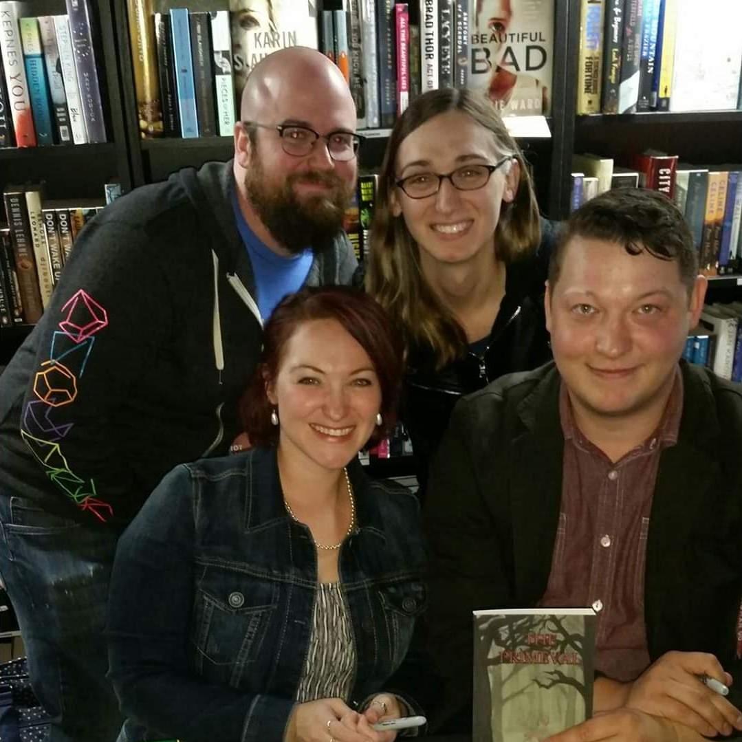 John and Amanda with Val and Pete at their book signing.