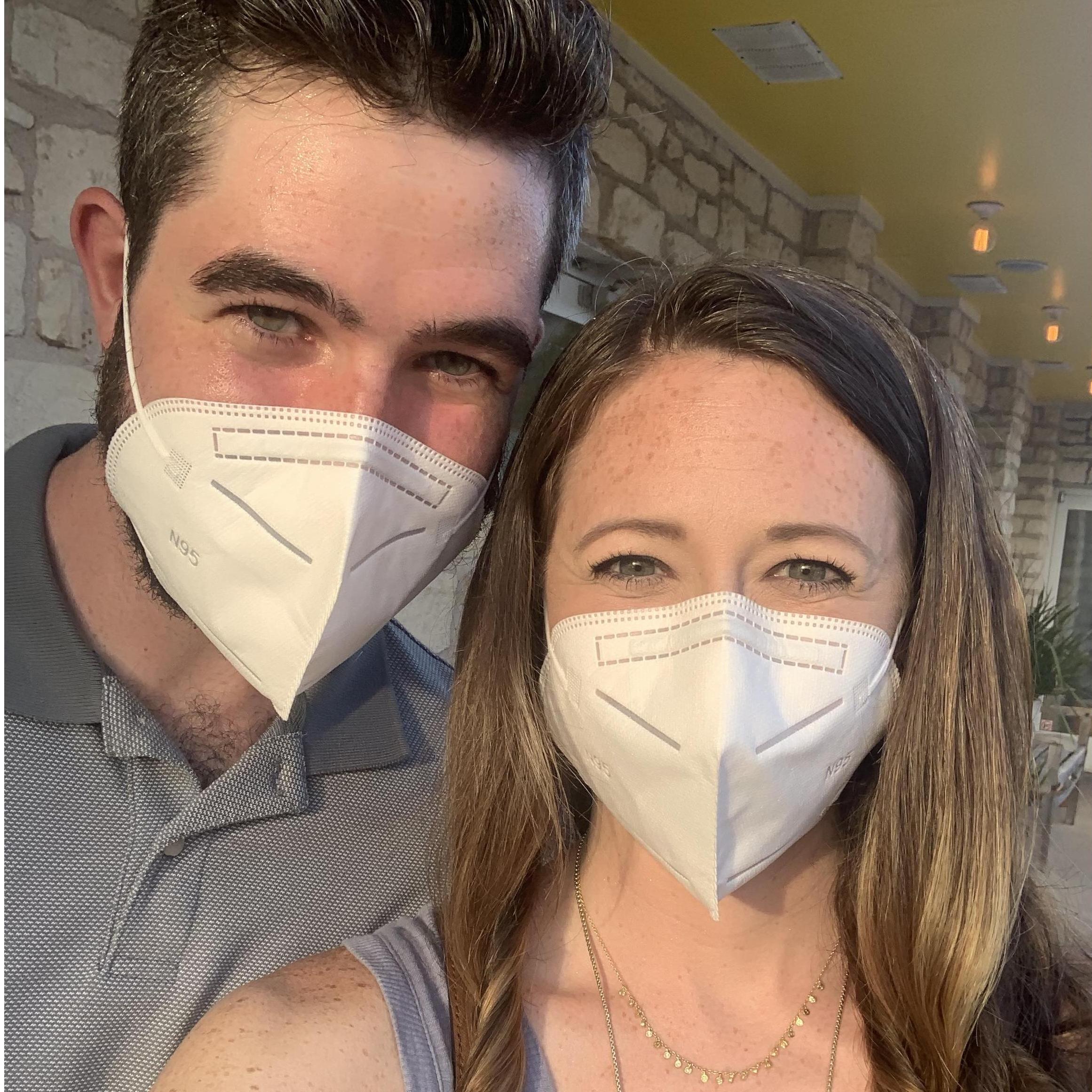 Smiling under masks during a rare 'out of the apartment' date night.