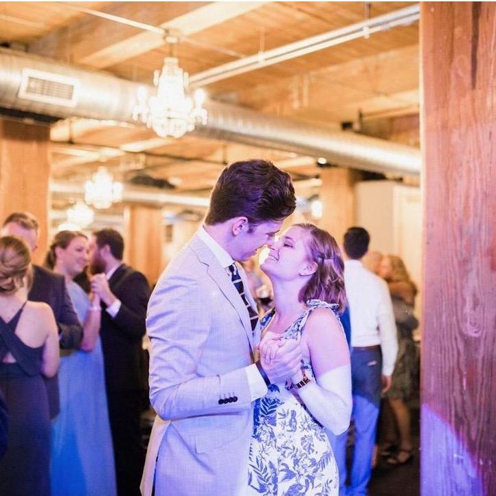 Enjoying each other's company on the dance floor at a friend's wedding