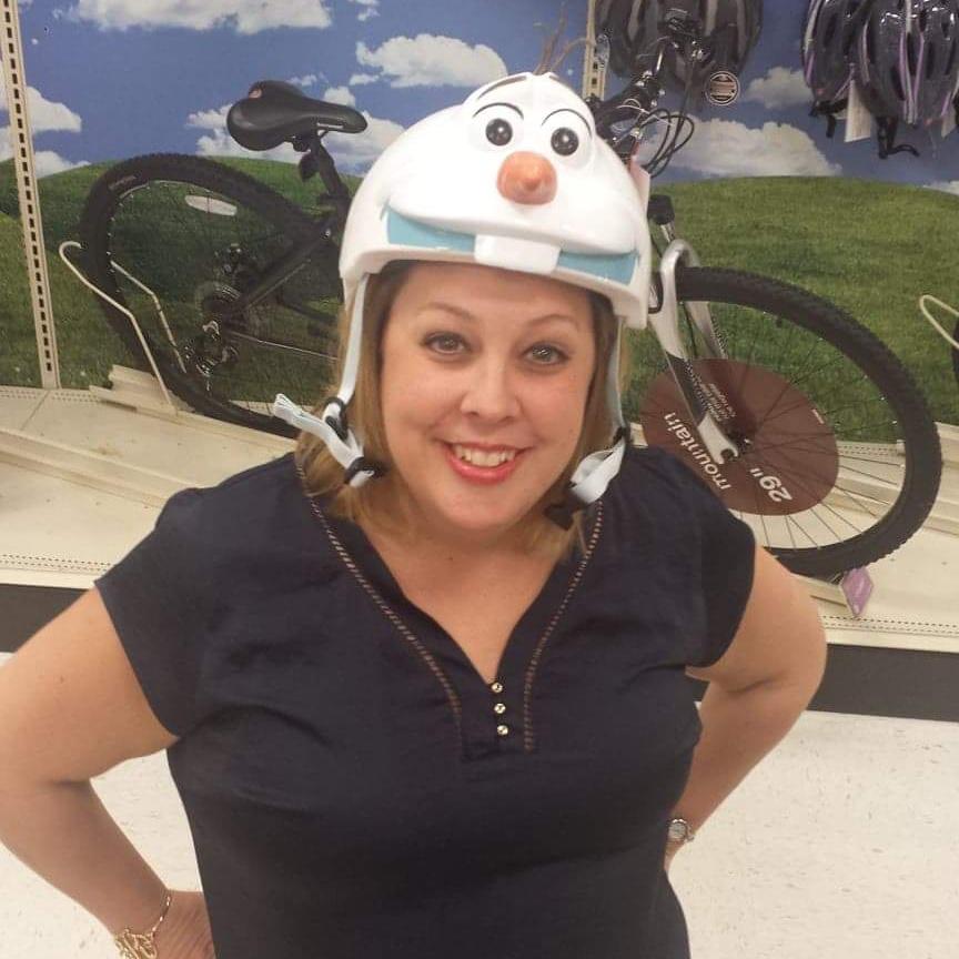 Richard loves to show this picture because the Olaf bike helmet (size to 5 years) fits Robin's small head.