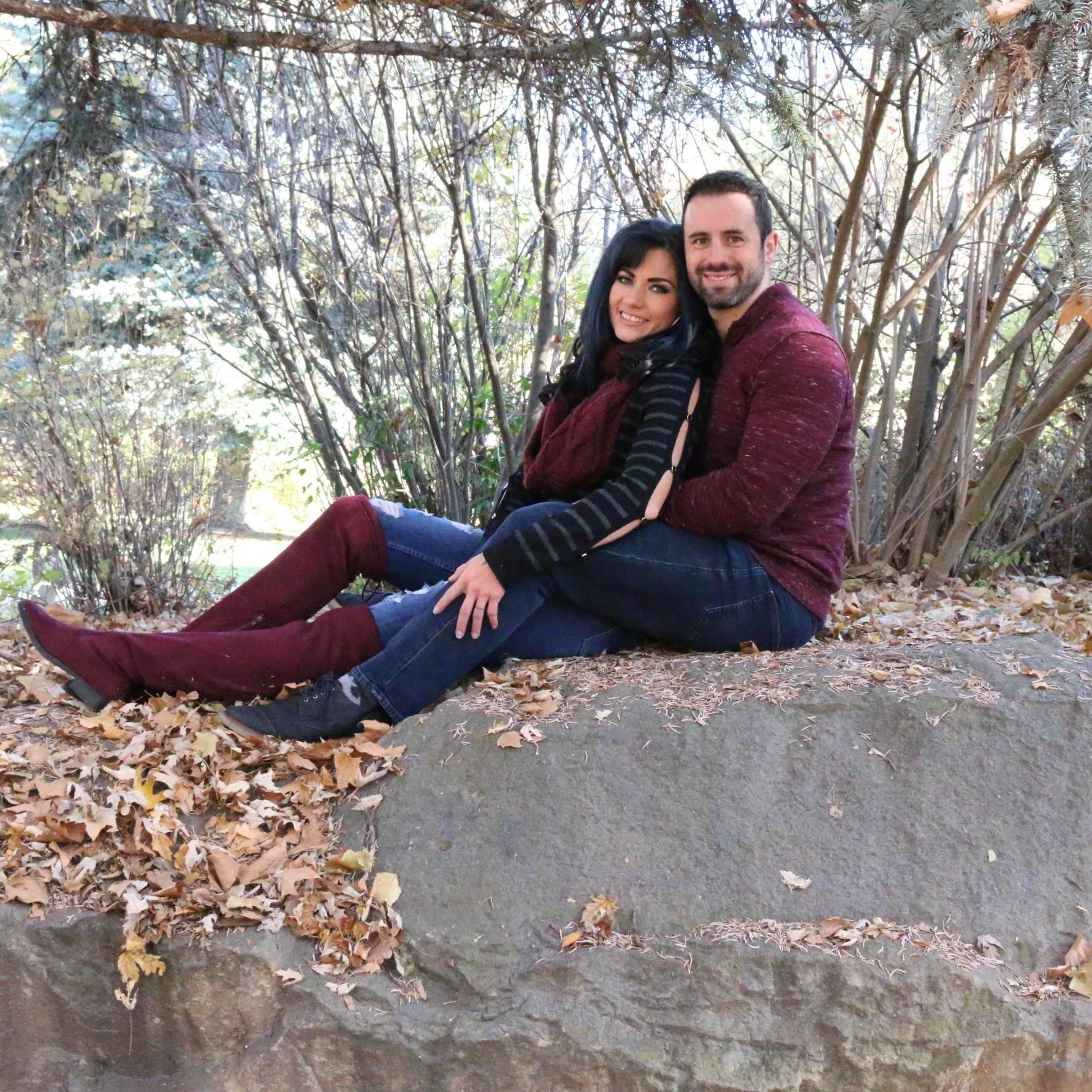 Just two people sitting on a rock