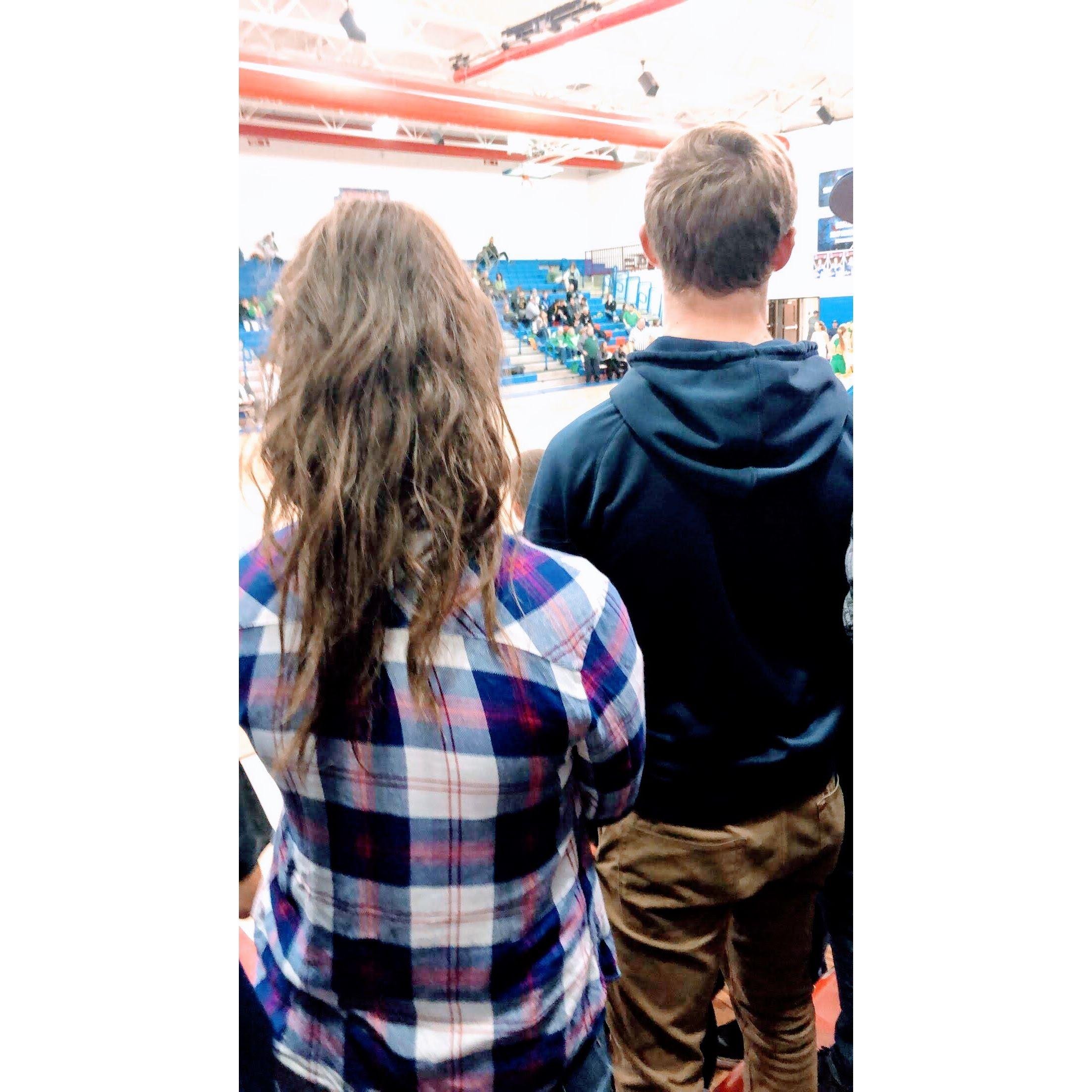 Our first date... a small town restaurant and a basketball game. We were too nervous to take an actual picture together, but Abbi snuck this photo from behind at the basketball game.