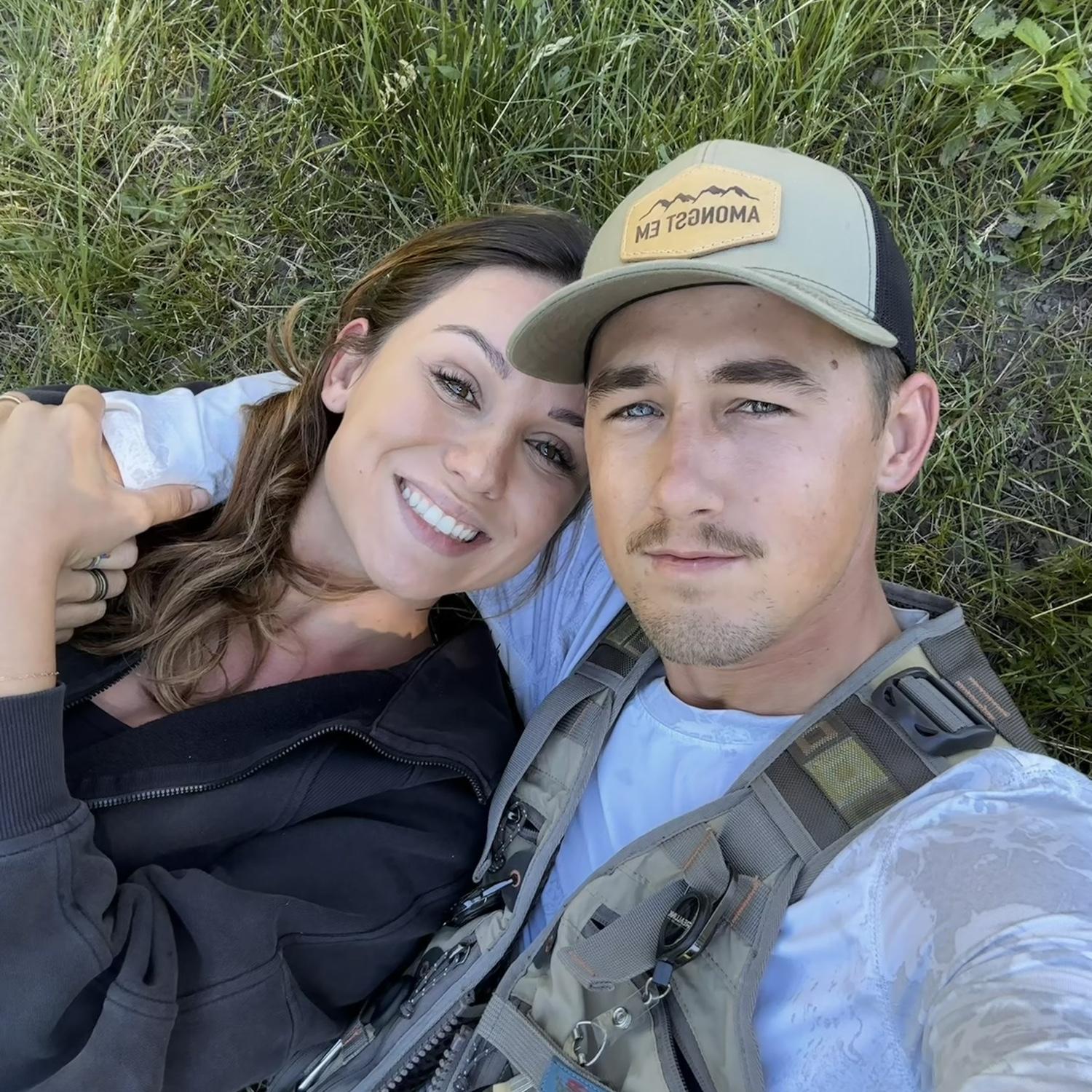 Taking a break from fishing, at the same pond he proposed on.