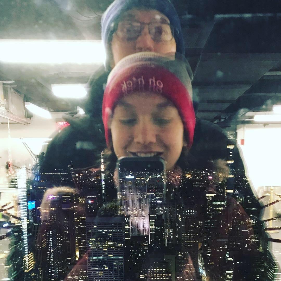 On top of the Empire State Building, with the New York skyline visible through the glass! Jan. 2018