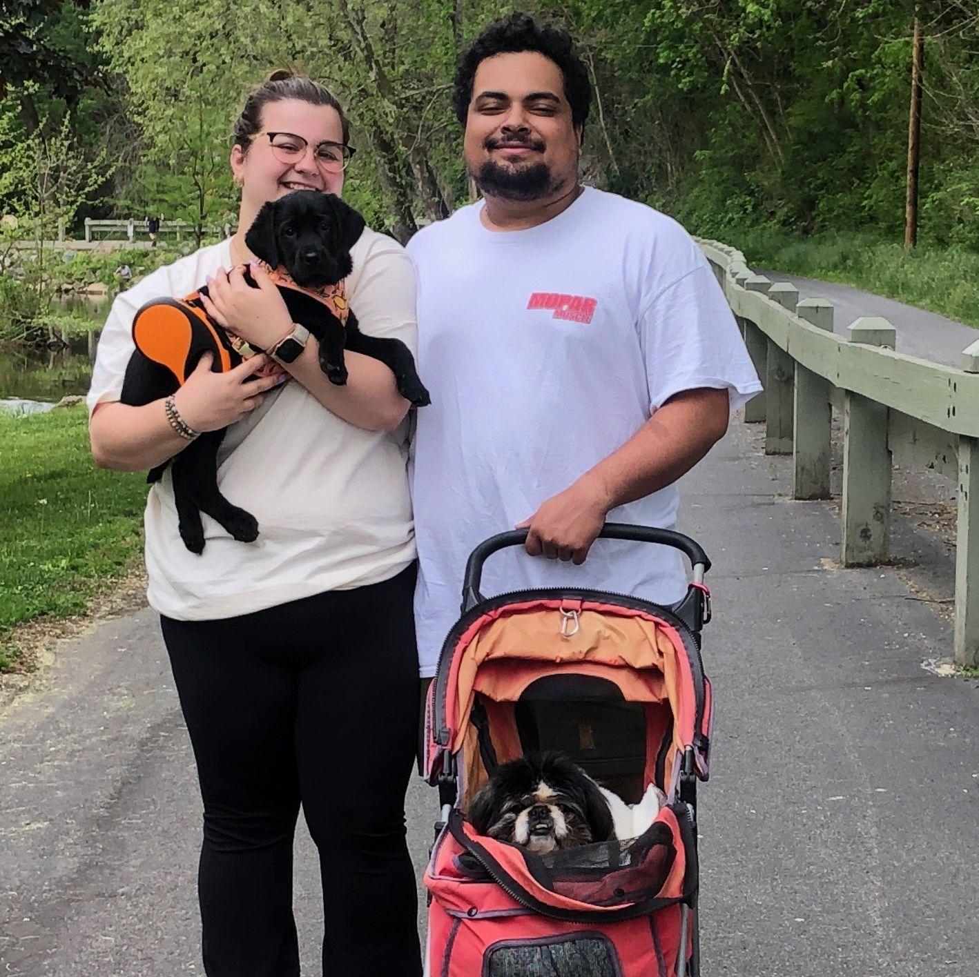 Us on a walk with our oldest and youngest pups!