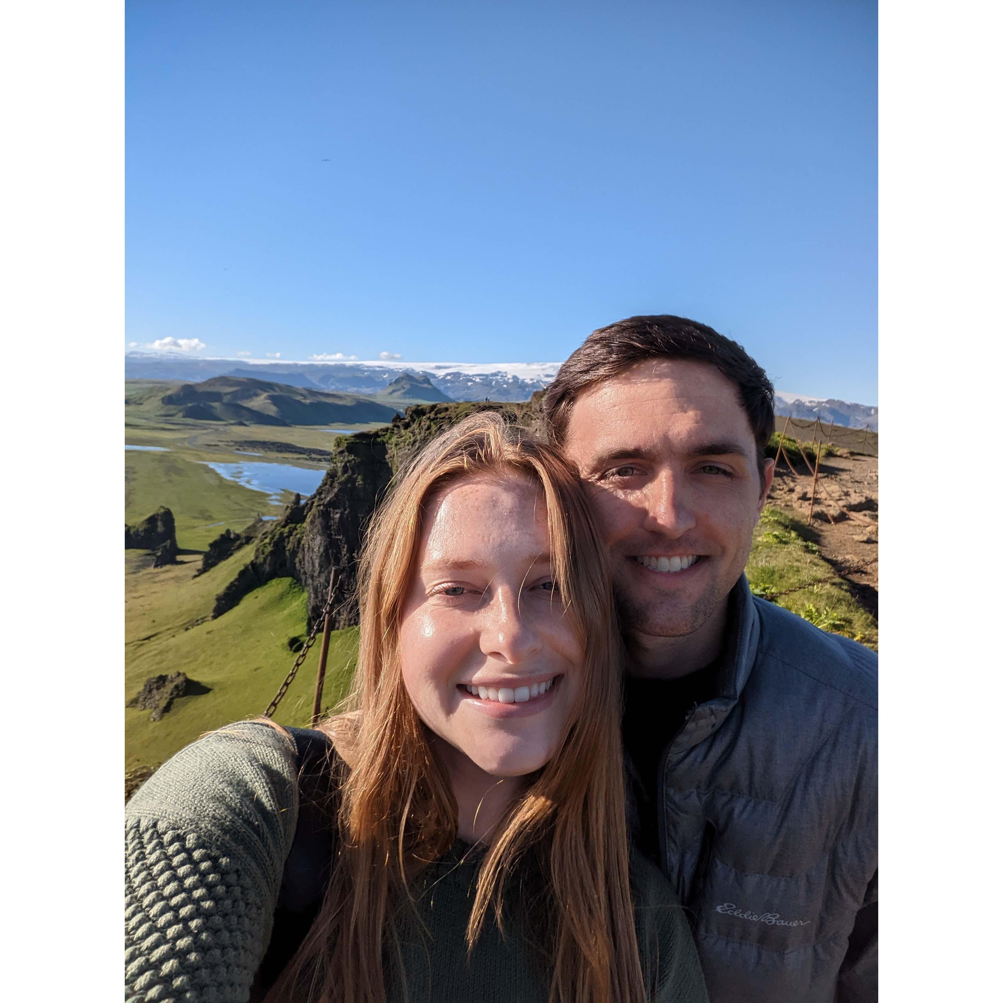 This was taken moments before Alex proposed! It was the most beautiful day and location you could imagine, on the Dyrholaey Cliffs overlooking the black sand beach, and a huge Glacier in Iceland!