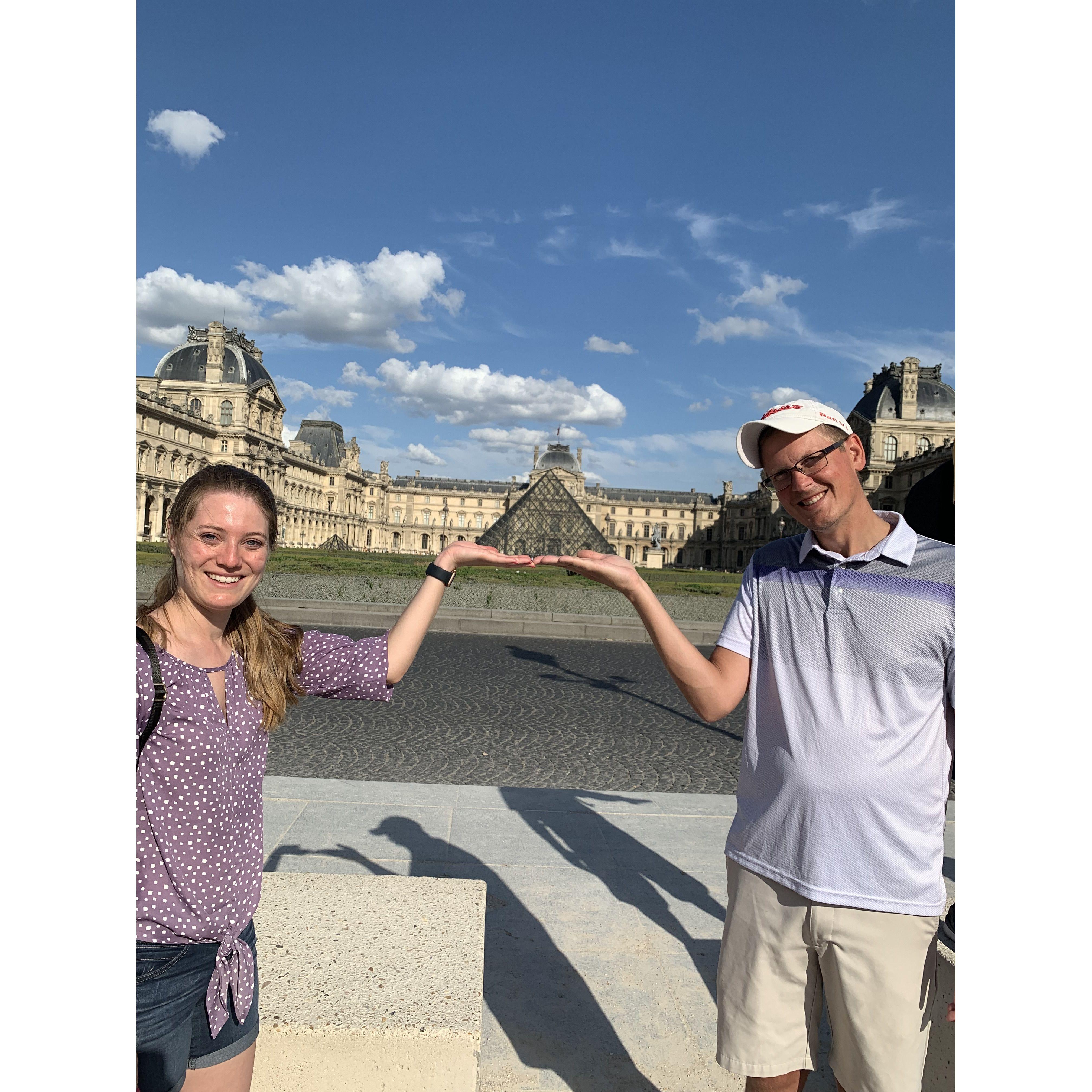 July 2022 tourist shenanigans in front of the Louvre.