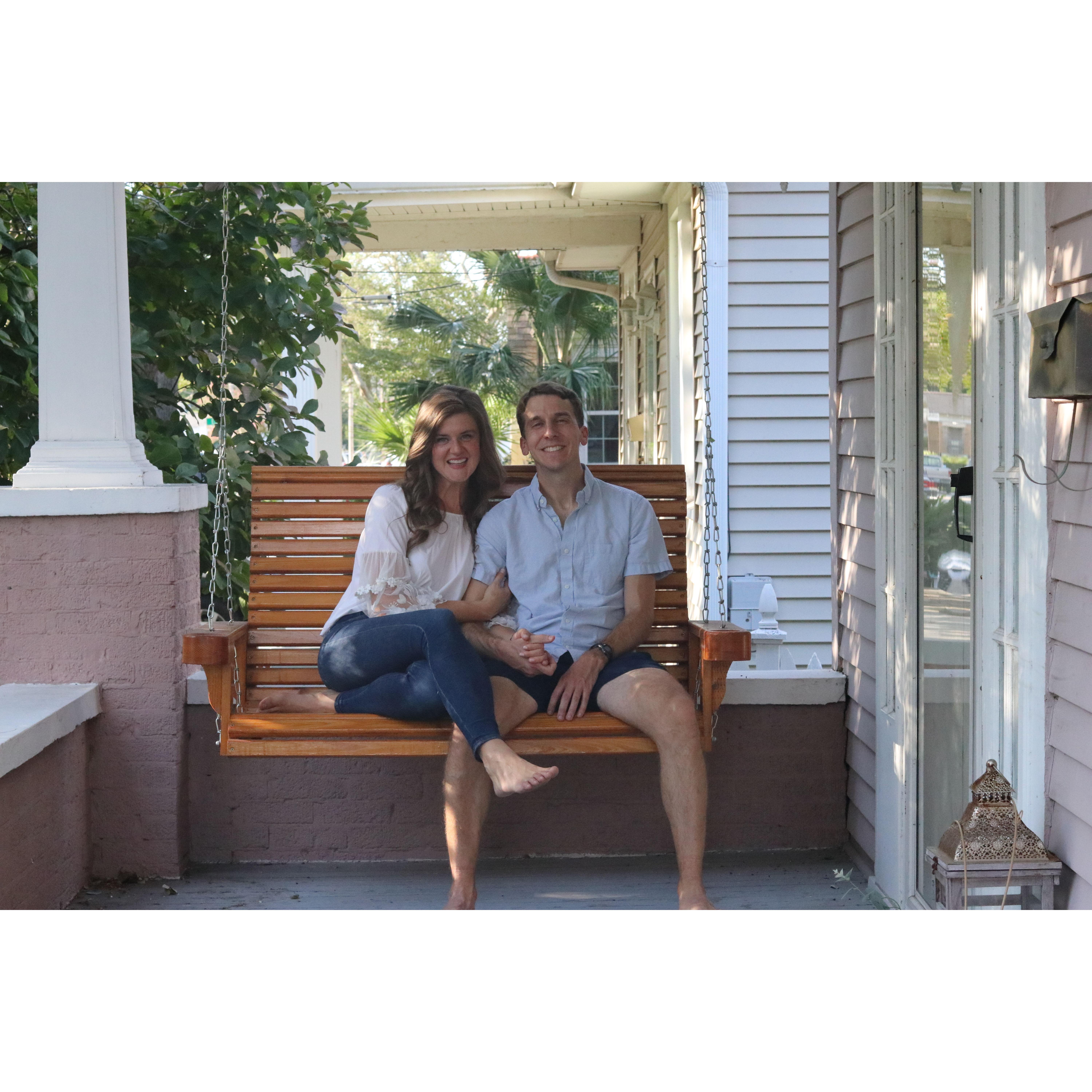 On our favorite front porch swing, i.e. our first home!