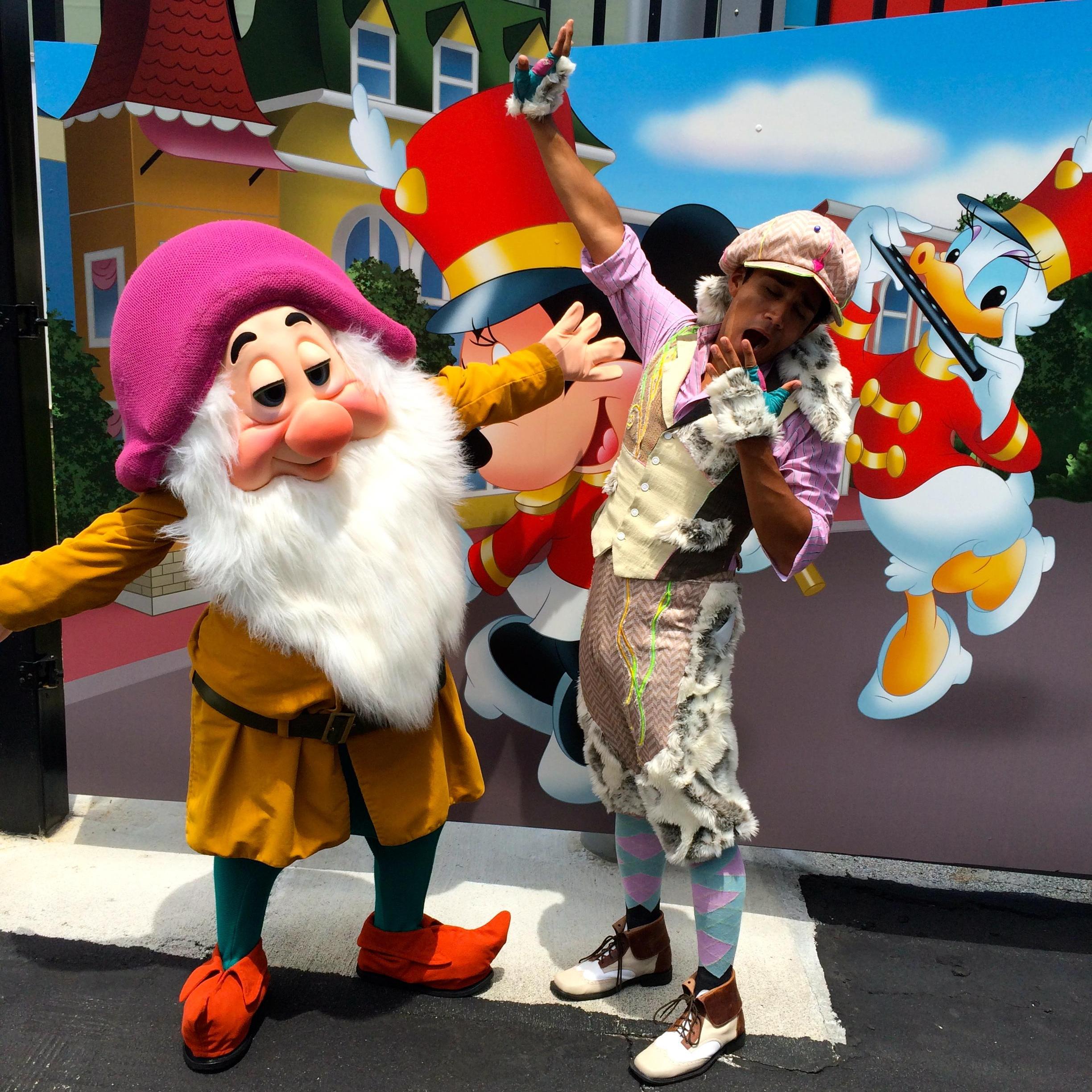 Sleepy (one of the 7 dwarves) and Nibs (one of the lost boys) getting ready before parade.