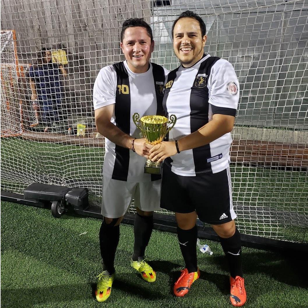 Julio and Carlos after they won the summer soccer season!!
