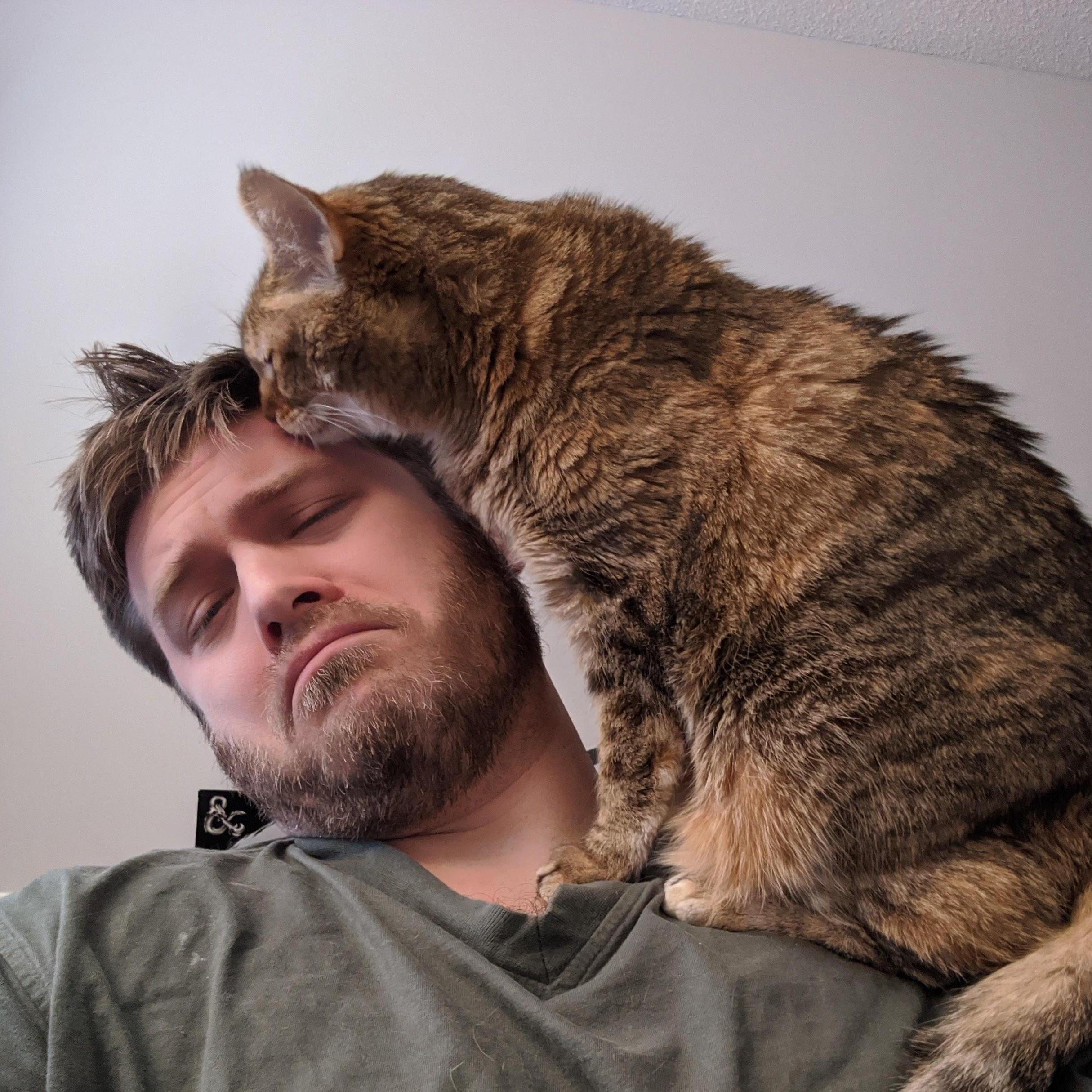 Archie likes to lick Eric's face. Eric does not like this.