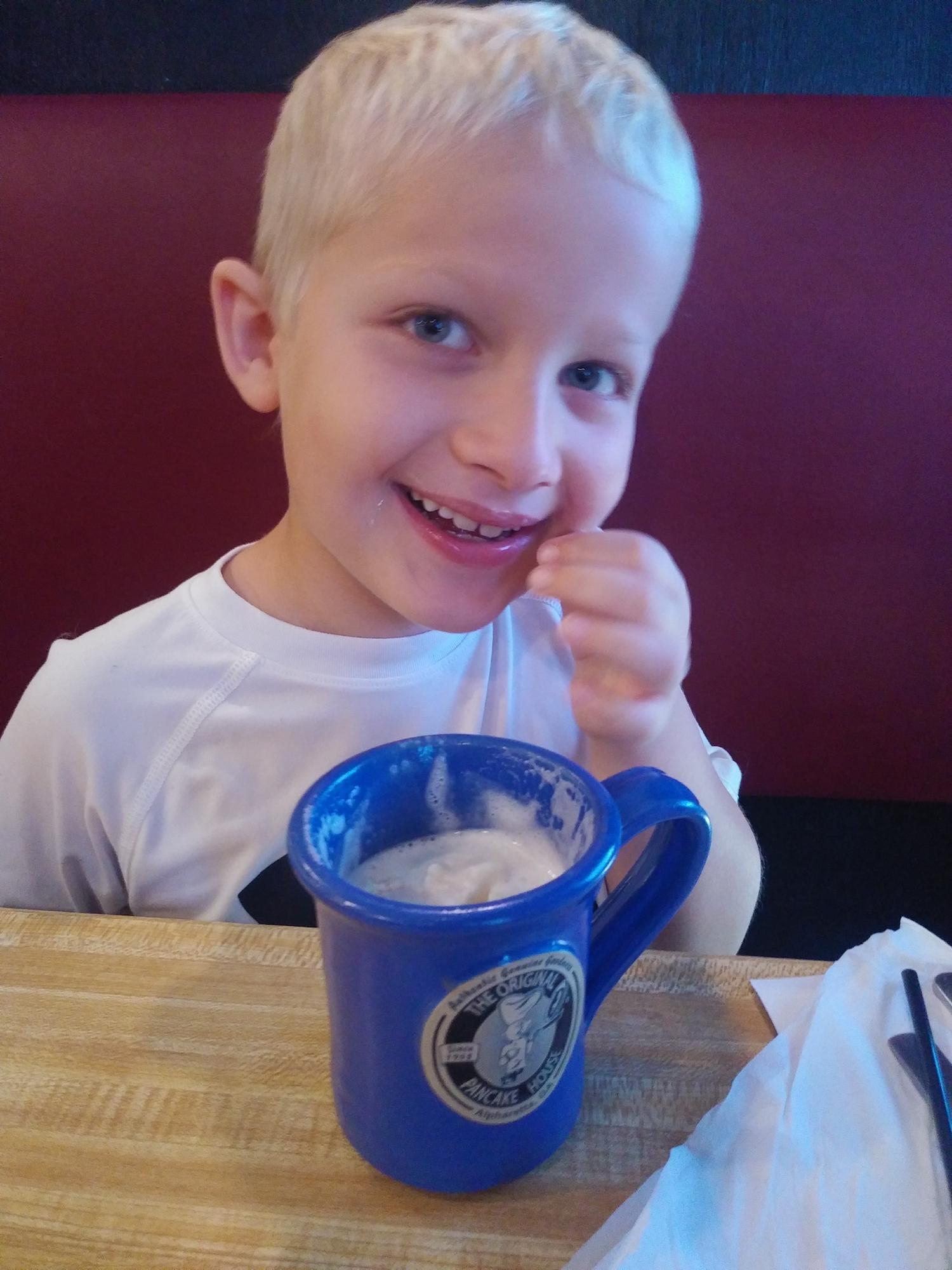 Hot chocolate and apple pancake smileys.
