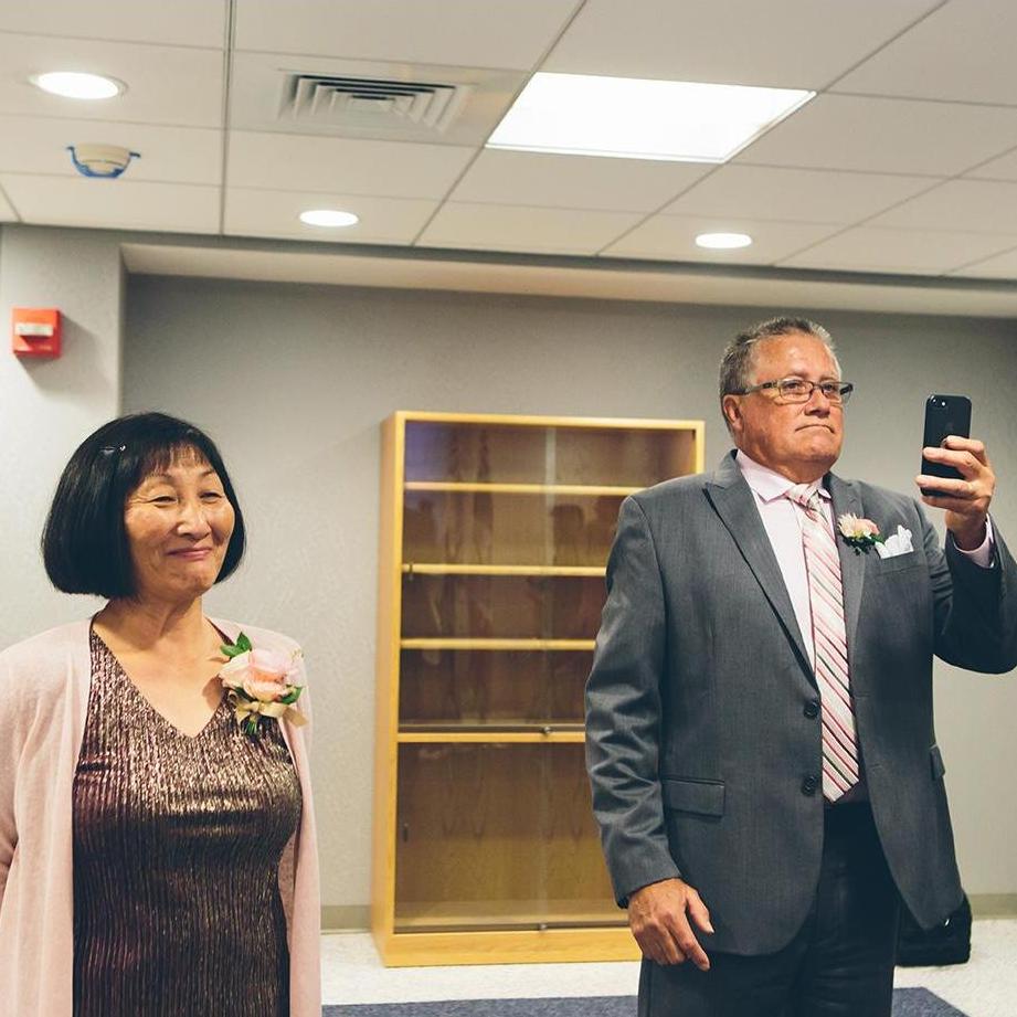 Parents of groom during vow exchange