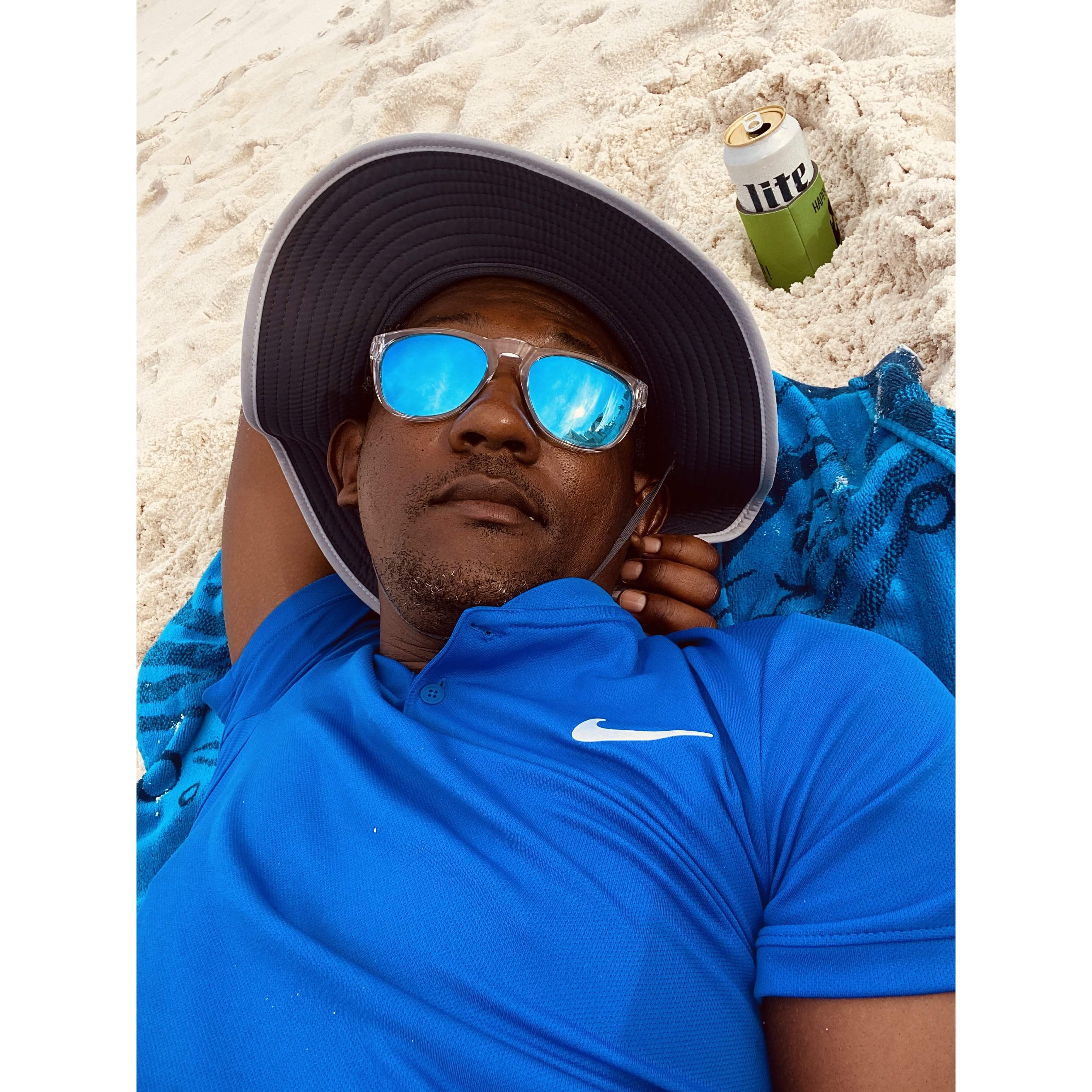 Relaxing at the beach, thinking of how lucky I am to have this man in my life.