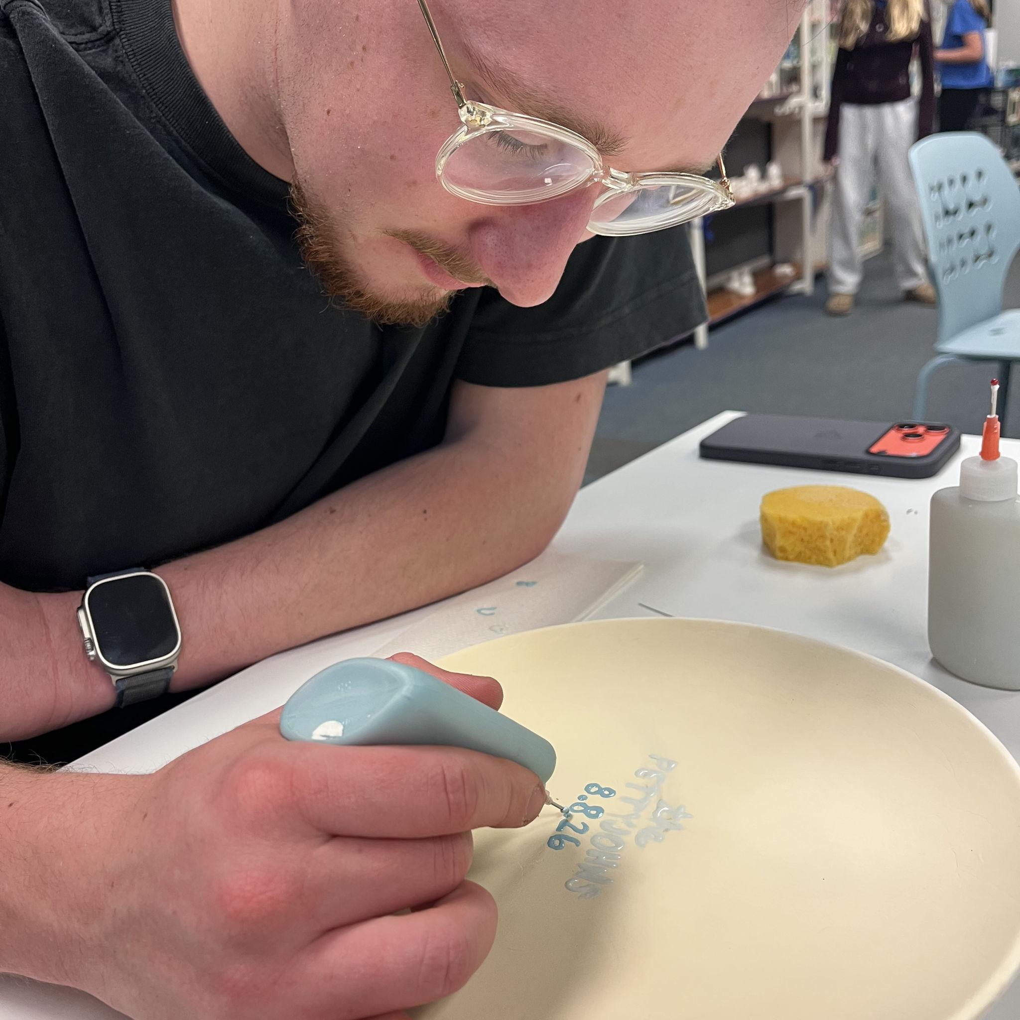 Date night painting our cake plate for the wedding!