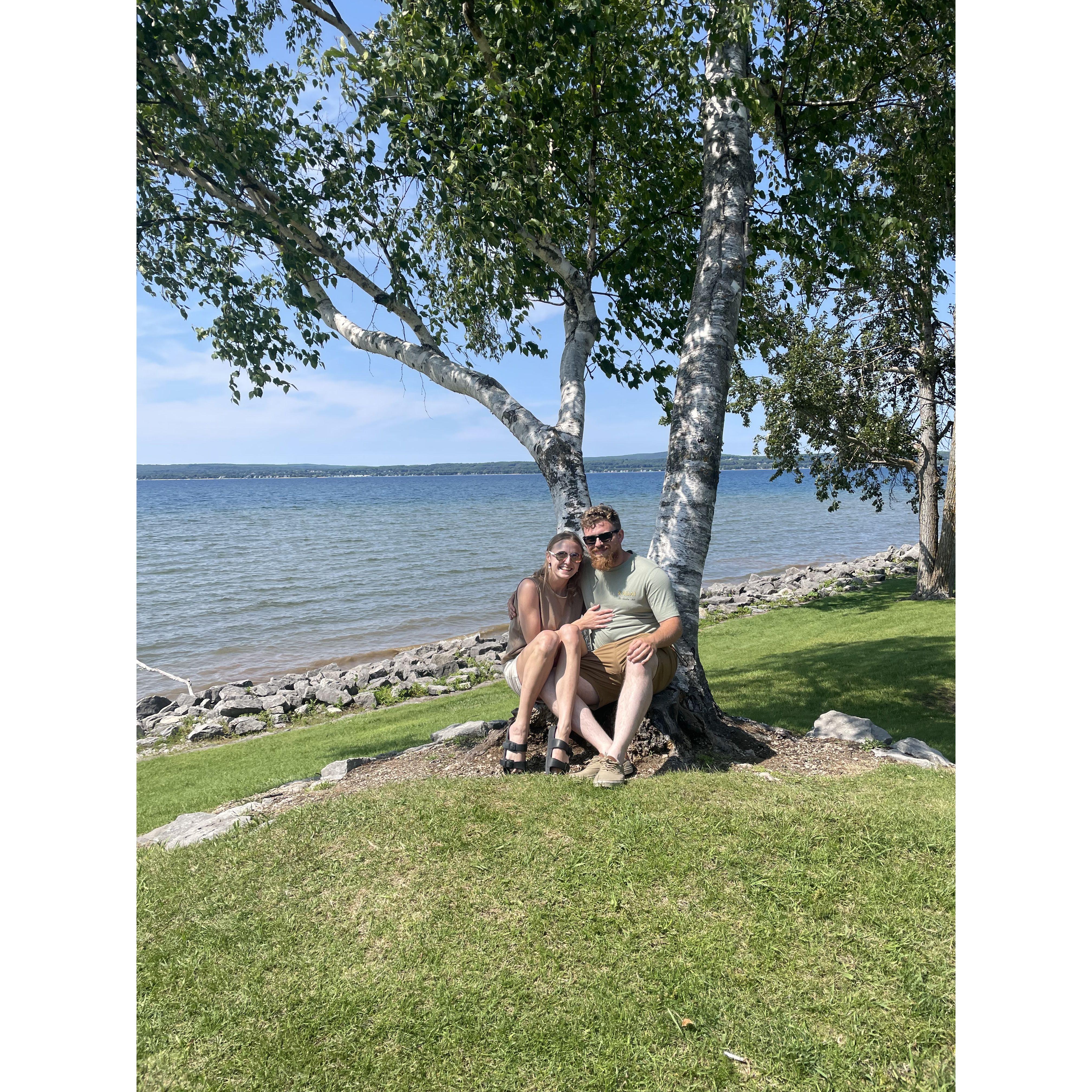 Matt and Erin under their tree a year before Matt proposed!