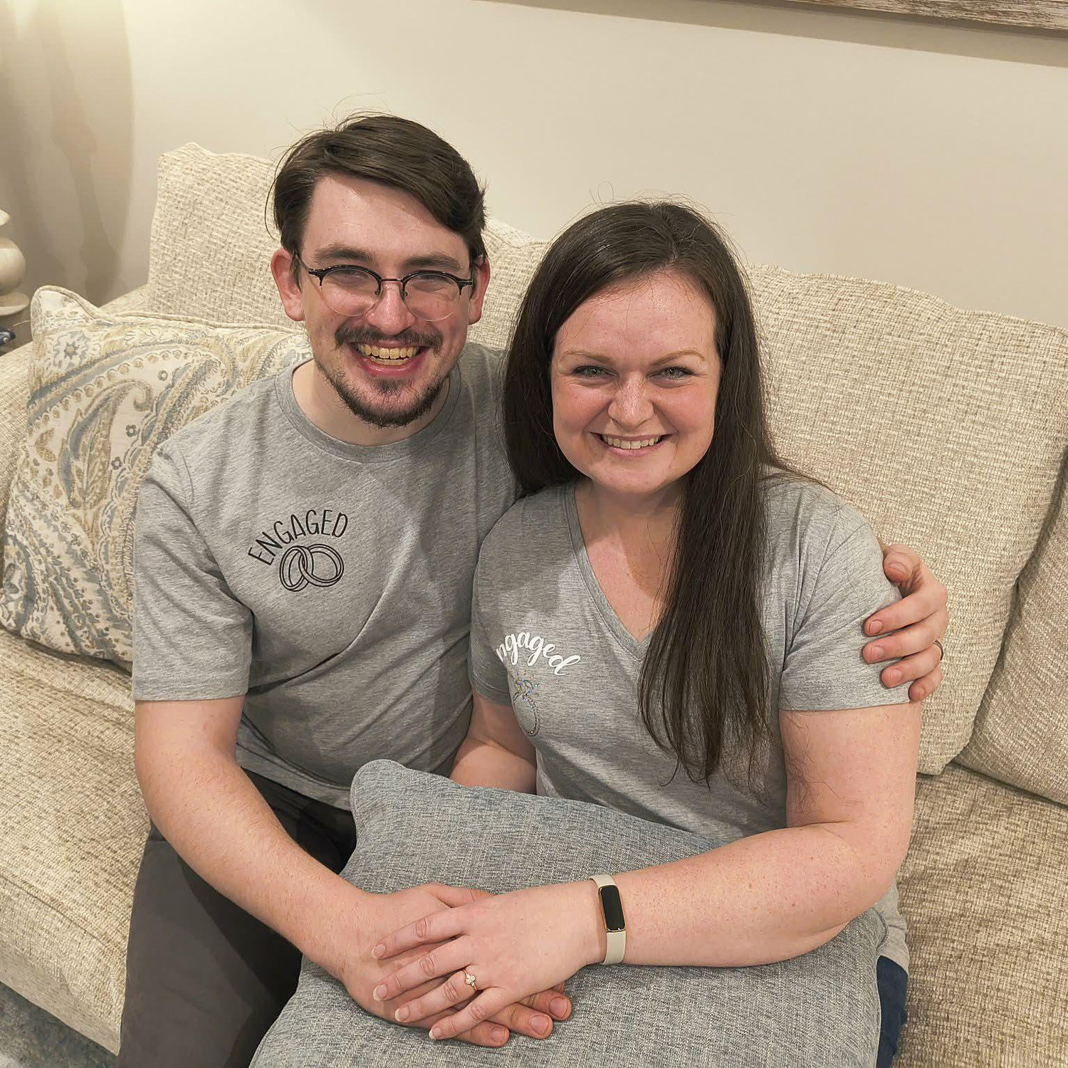 Right after getting engaged, sharing the news with Shaya's parents while wearing engagement shirts made by Trevor's mom!