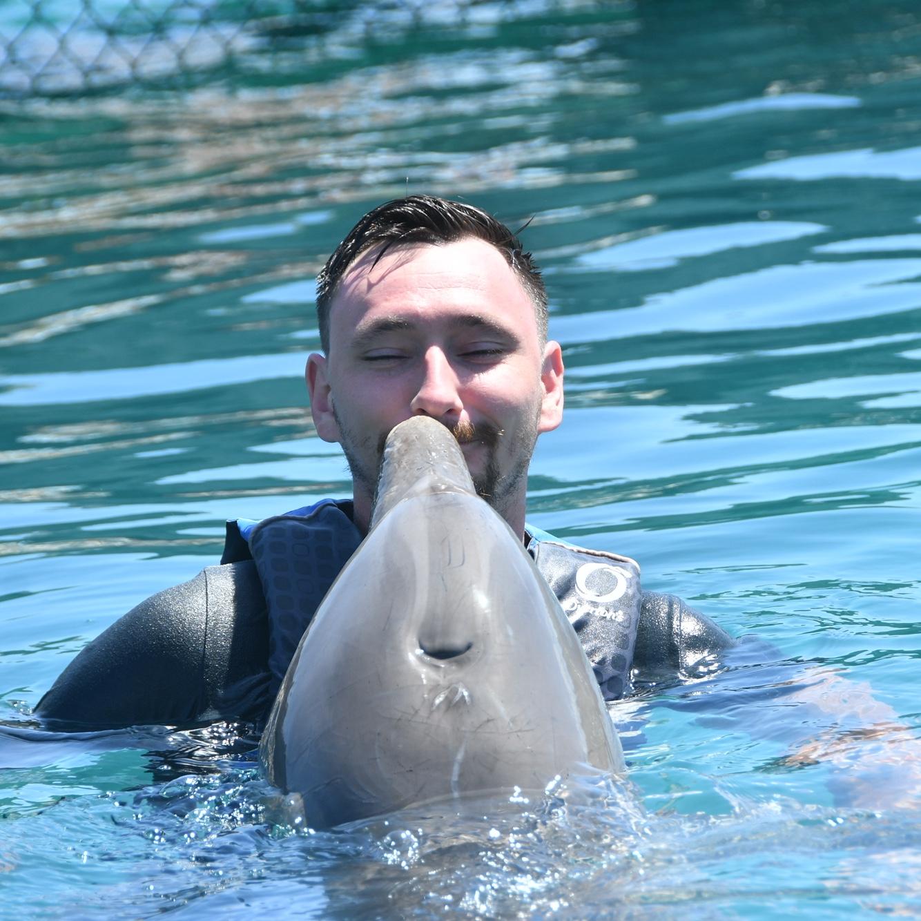 Kissing dolphins on one of our adventures! Ryan snuck in a lips kiss hehe!