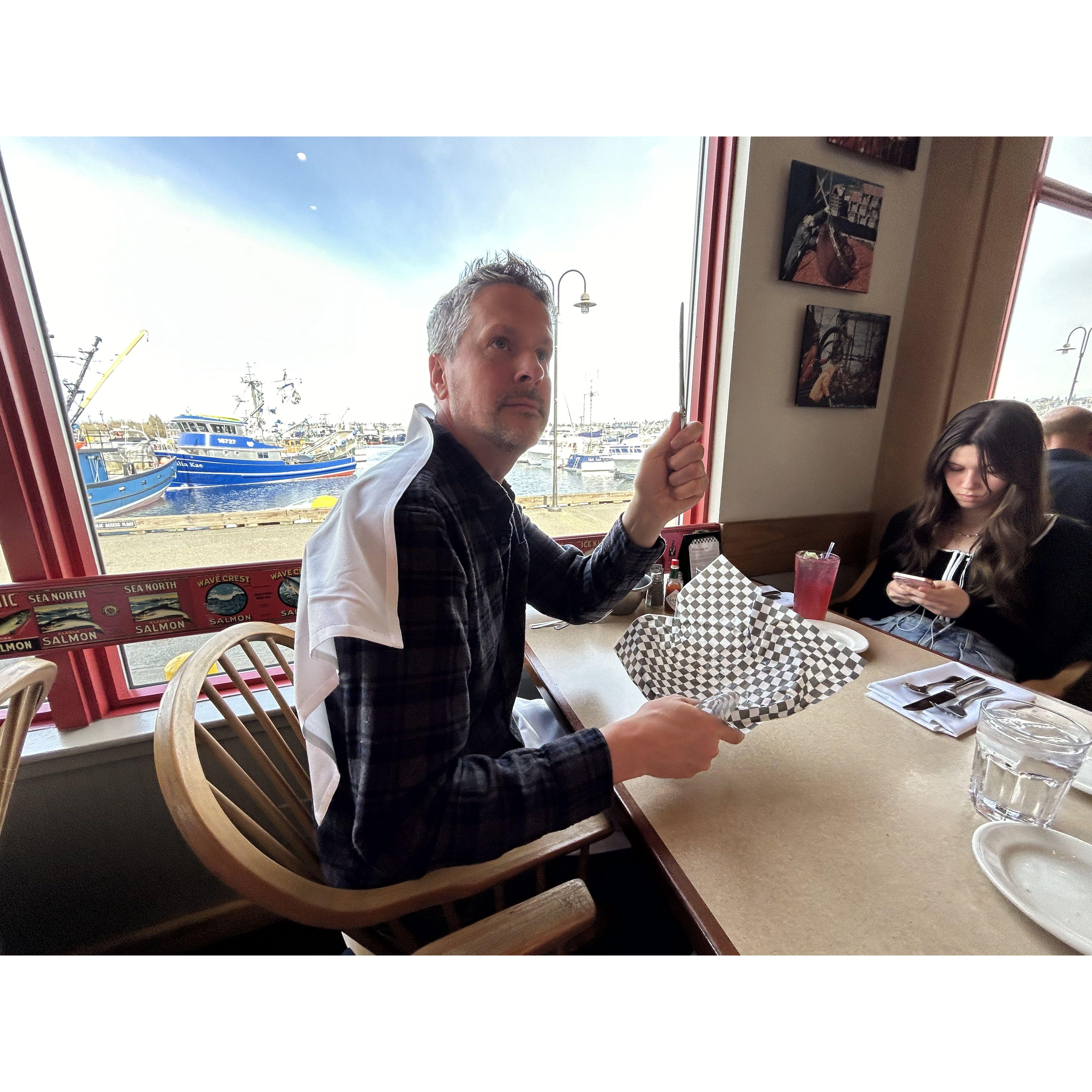 David getting his hero cape after being the brave one to ask for more bread again at Chinooks! Iykyk