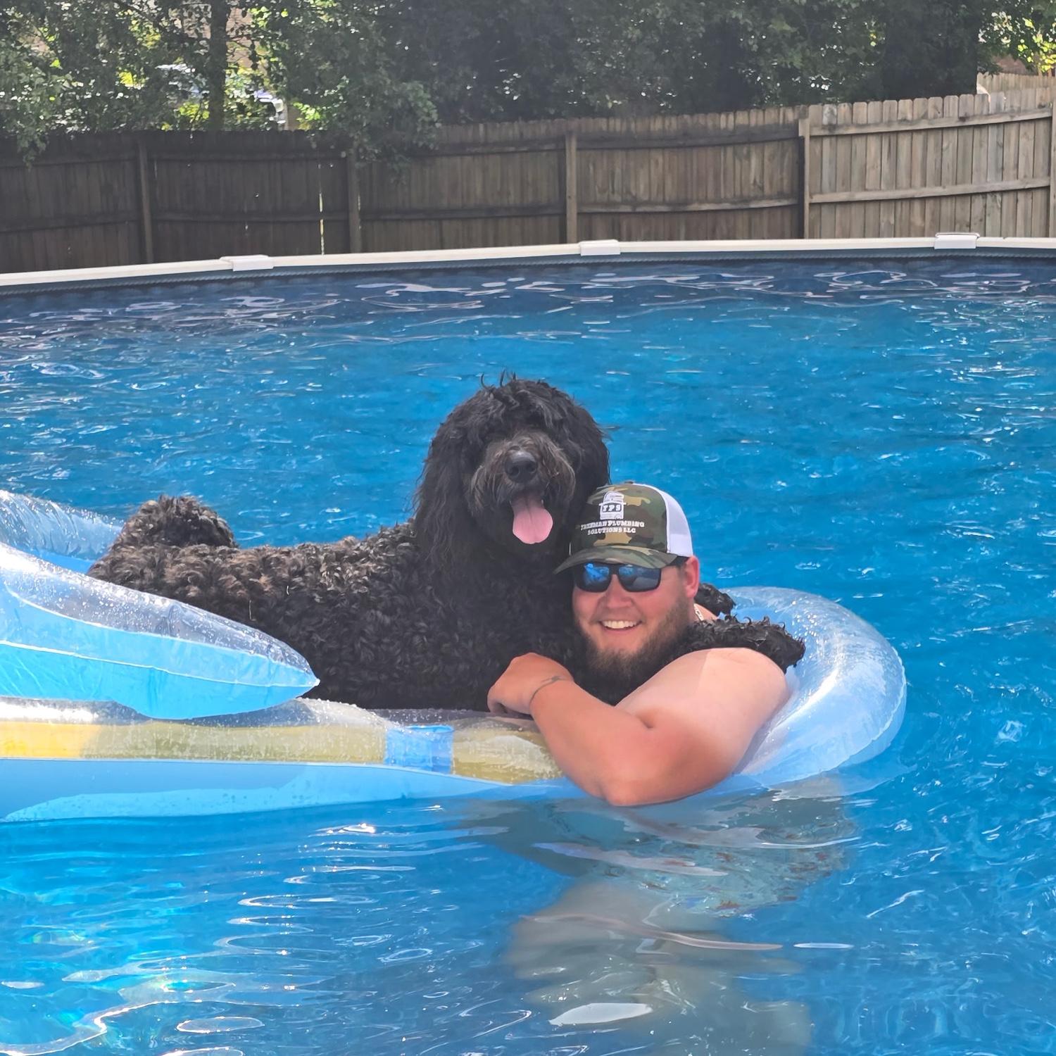 Getting the dogs in the pool was definitely part of the wedding planning process
