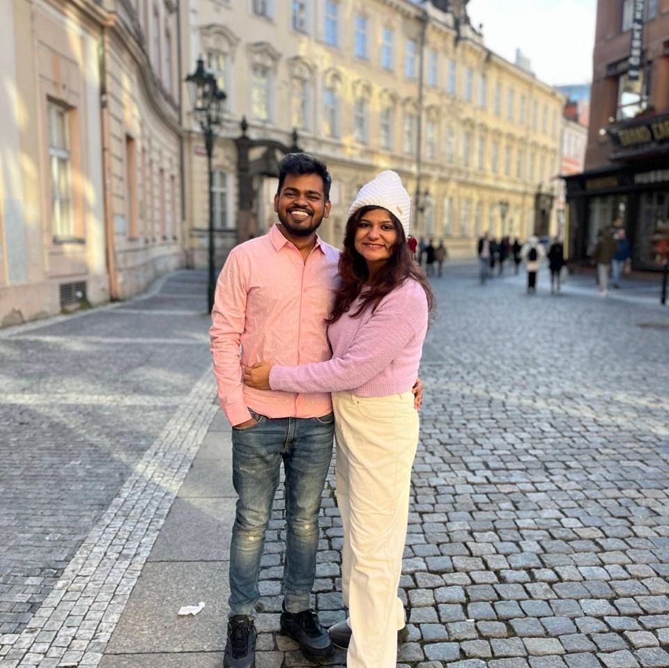 I officially don’t know when we became that couple, but here we are—accidentally matching and not even mad about it! Pink and purple in the city." 🌸