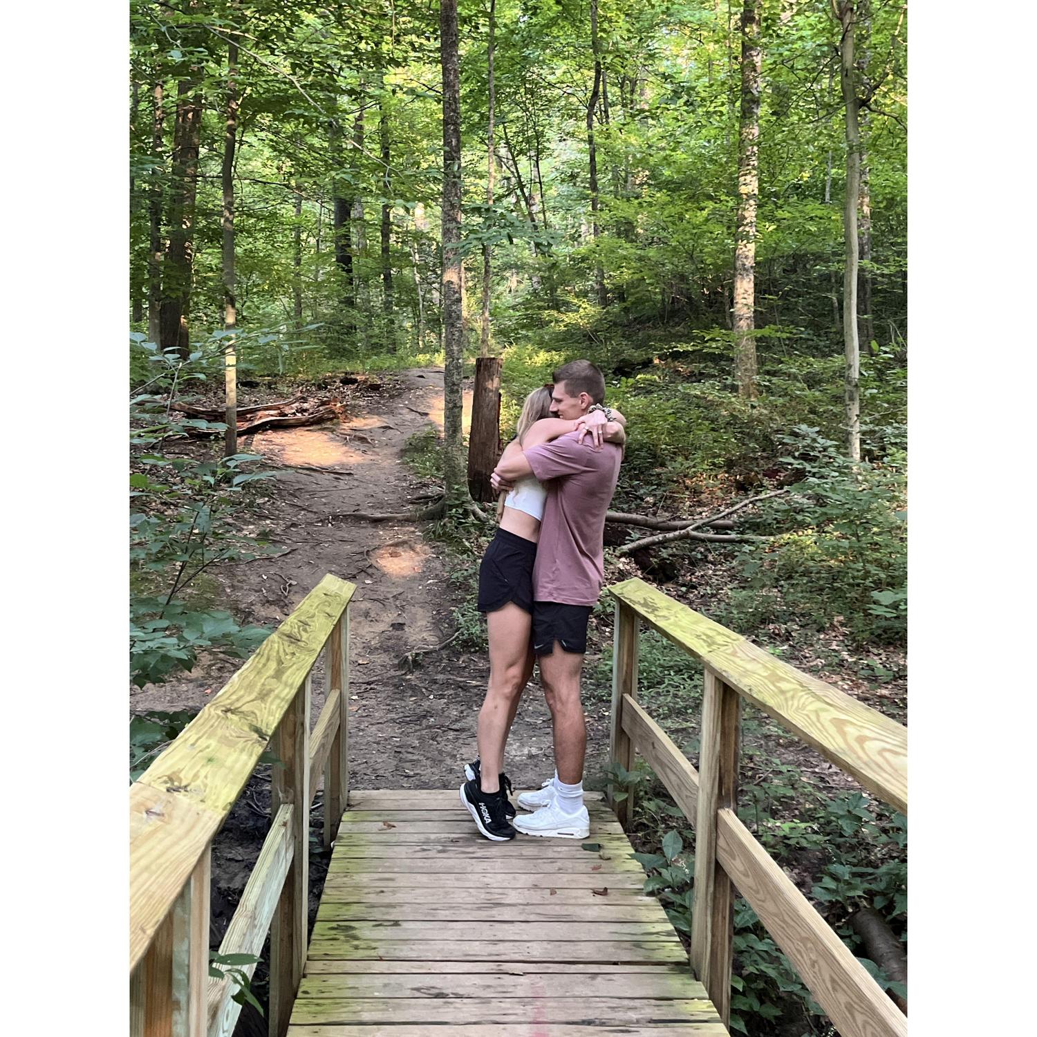 Post proposal hug on the path we took on our first date.