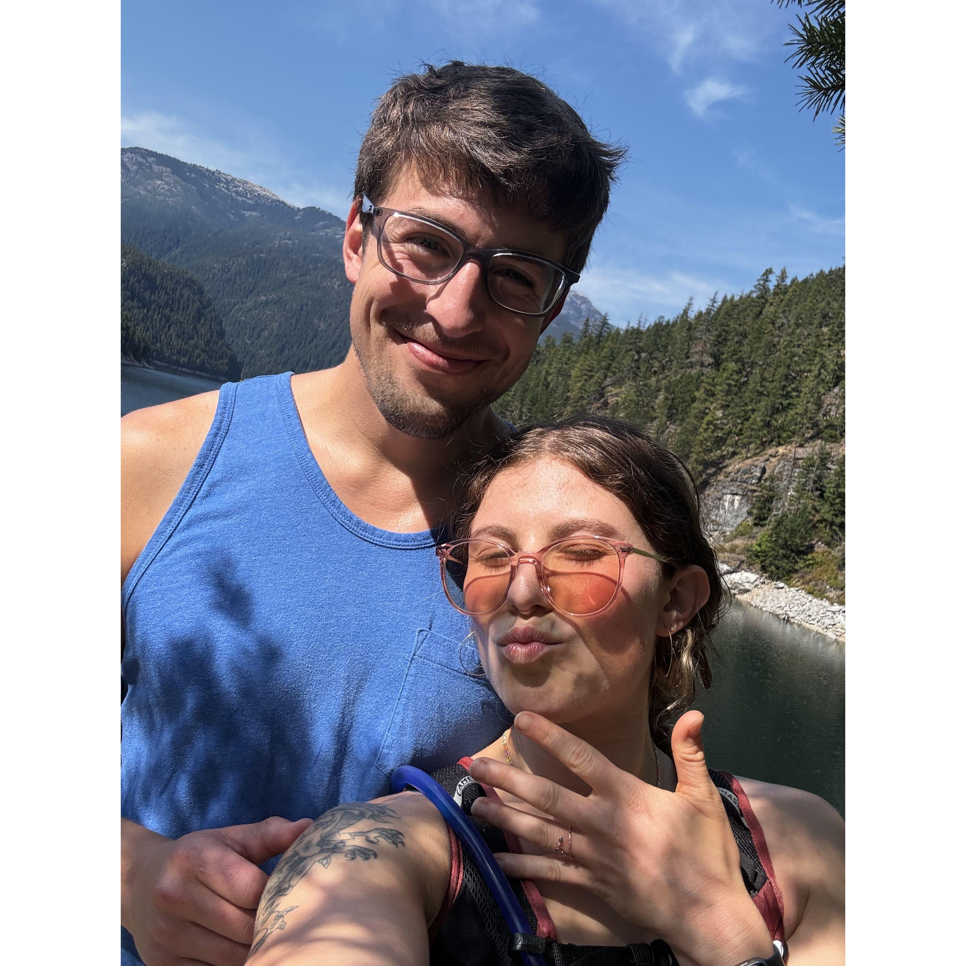 Engaged! North Cascades National Park. He found the perfect cliffside with a cute little tree. We swam in the river right after :-)