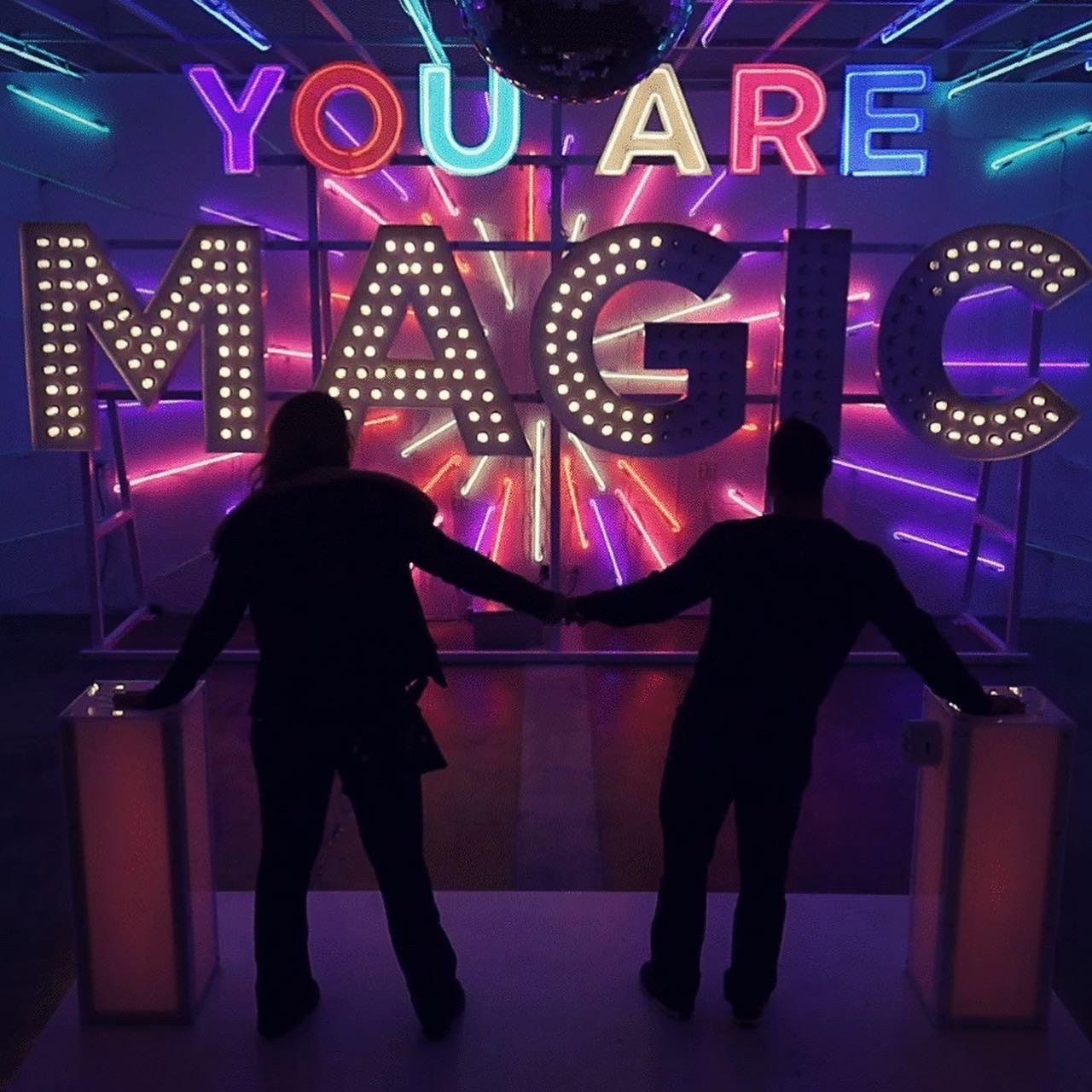 If we held hands and touched the pillars together, we connected a circuit that made this entire room light up like magic!