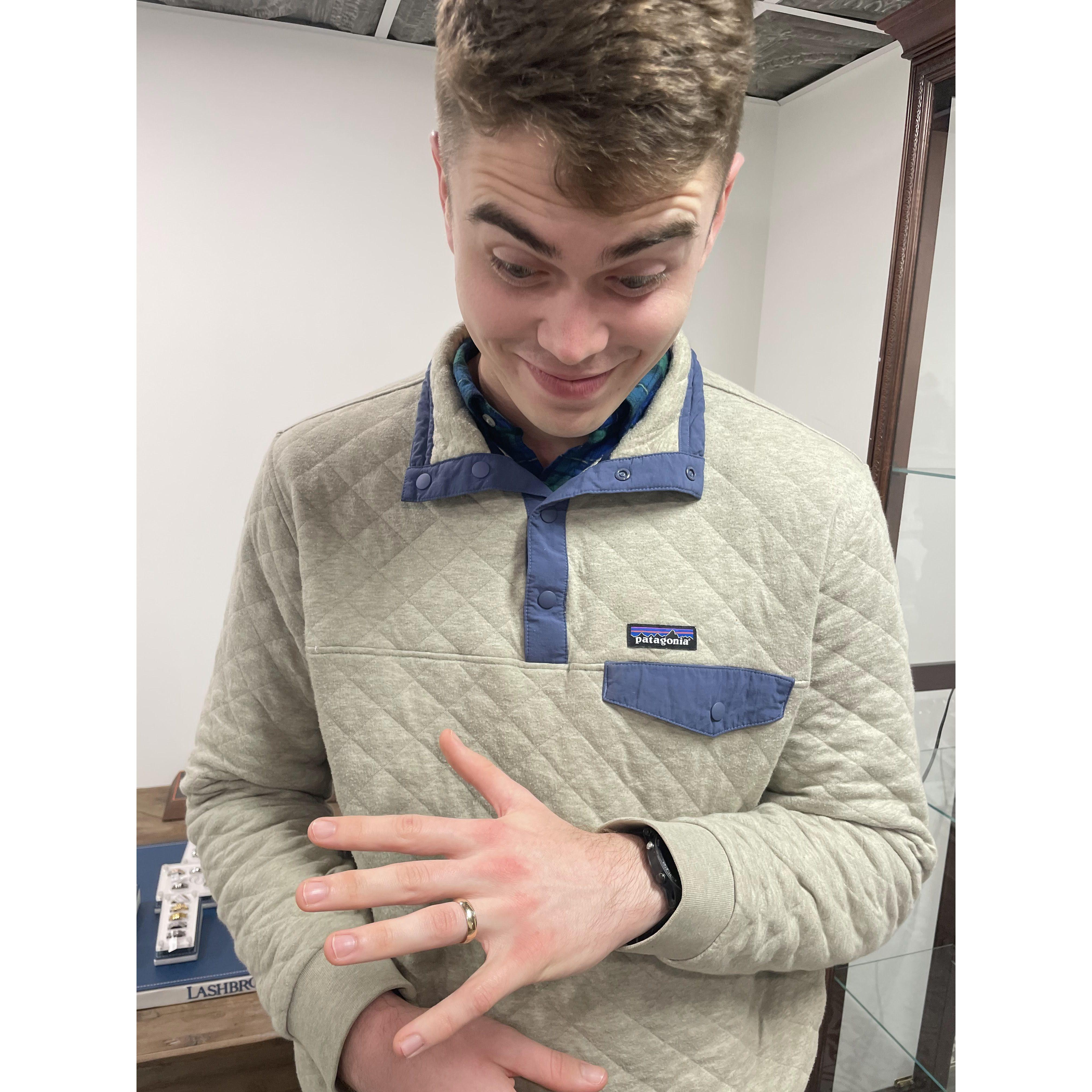 John trying on wedding bands