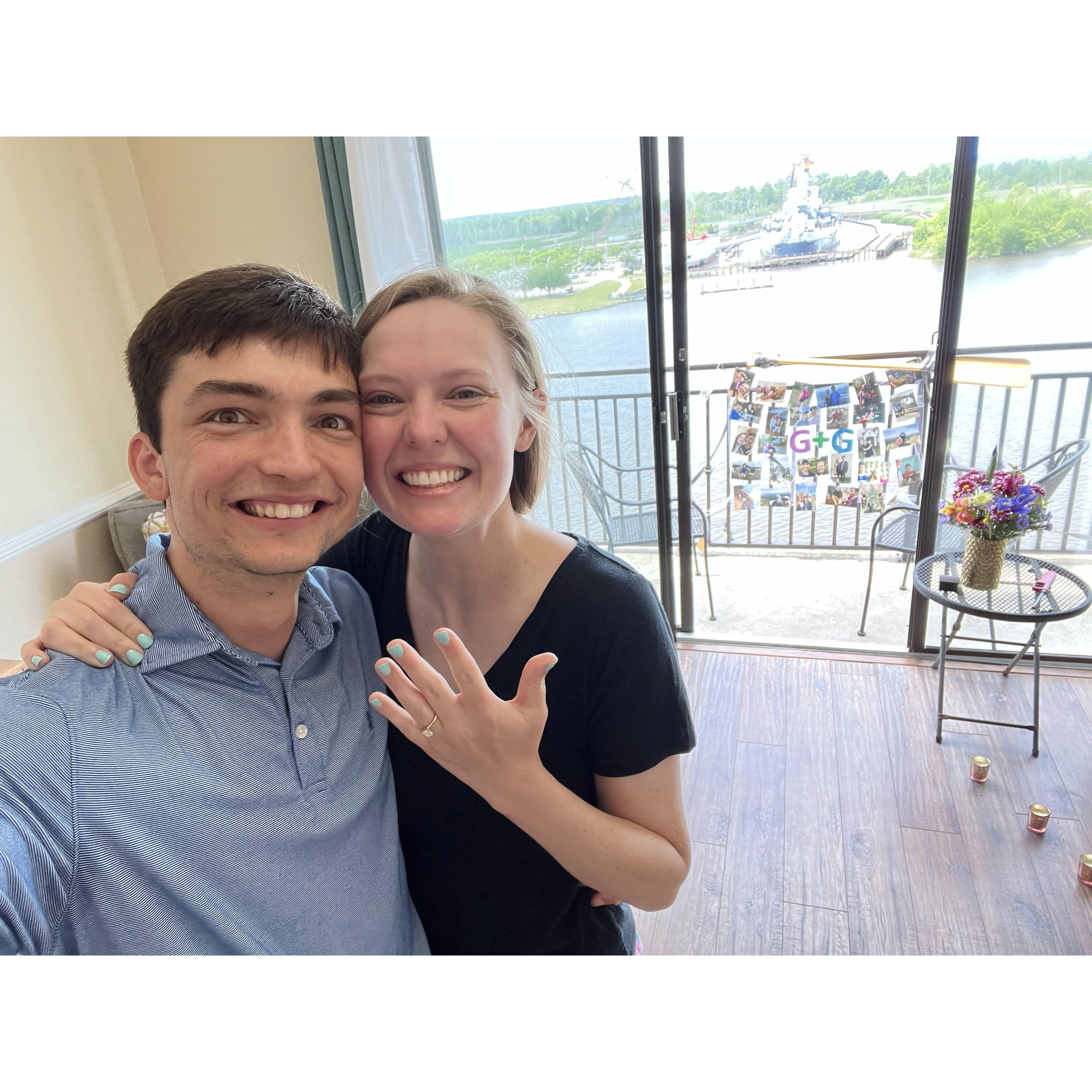 Right after getting engaged eight floors above the Cape Fear River in Wilmington! The oar from the first date is on the porch in the background with the collage.