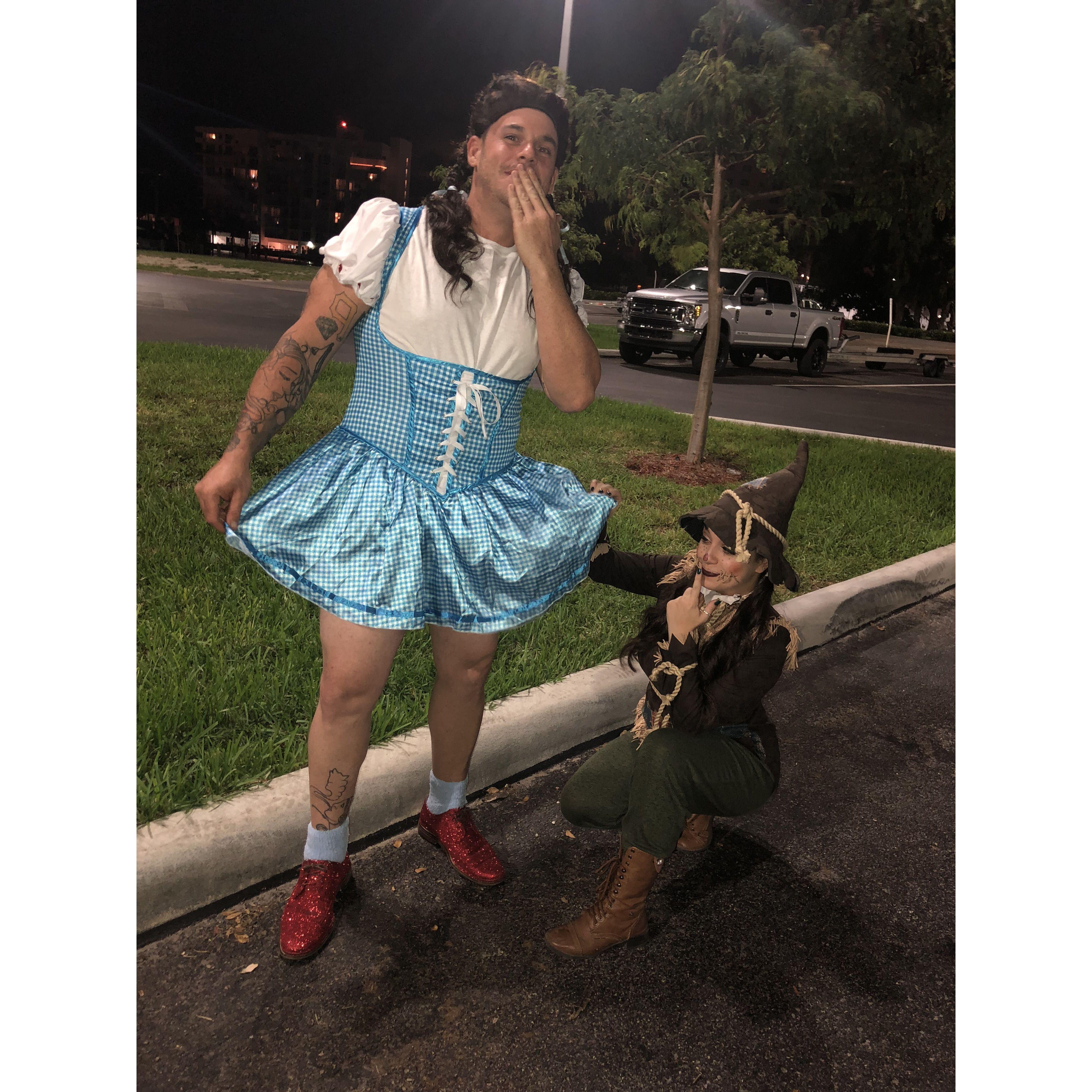 Our first Halloween together! Tough getting a grown man in a dress.