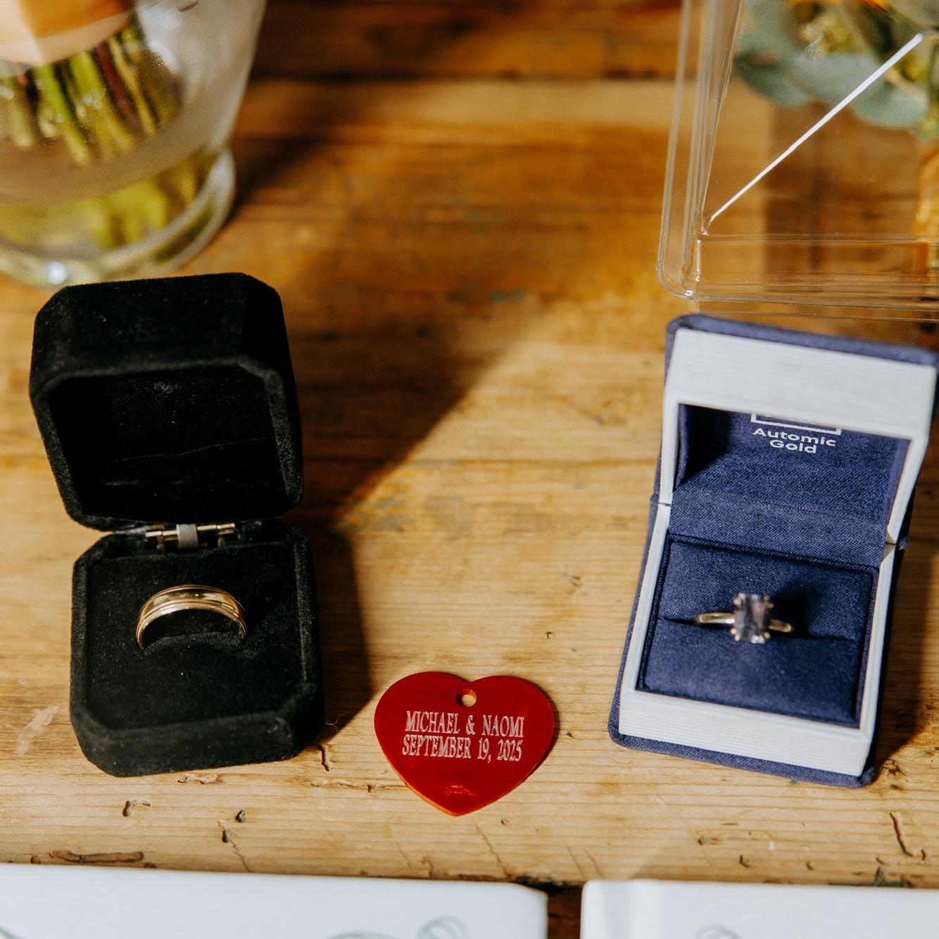 Close up of the rings! In fashion of our relationship, we got a custom dog tag with our names and date!