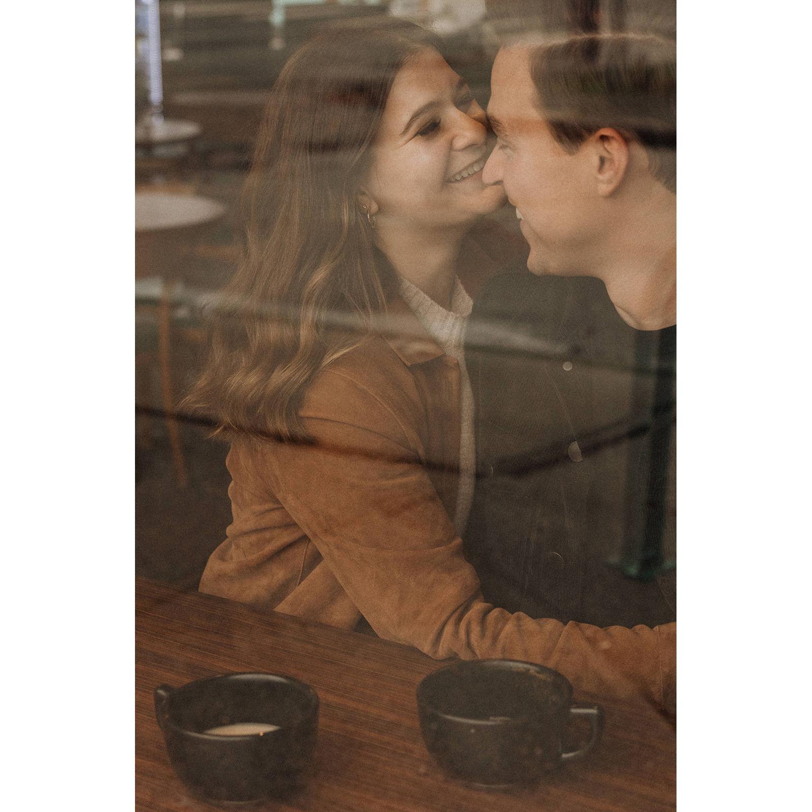 Engagement photos by In the Alpenglow at Bluebeard Coffee Roasters on a rainy day in Tacoma, Wahington in the fall of 2023.