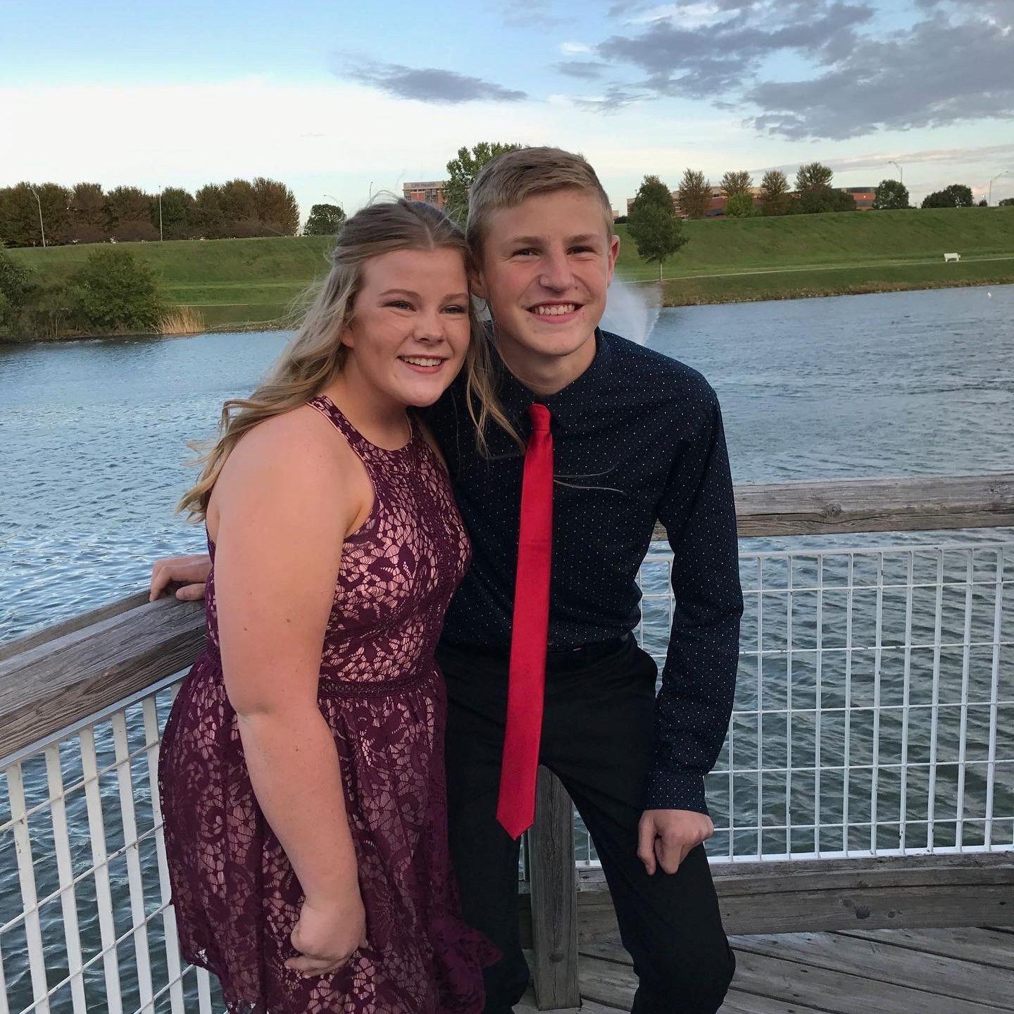 Our first picture ever together! Freshman year homecoming. Thanks Josh for crouching down so much for this perfect picture.