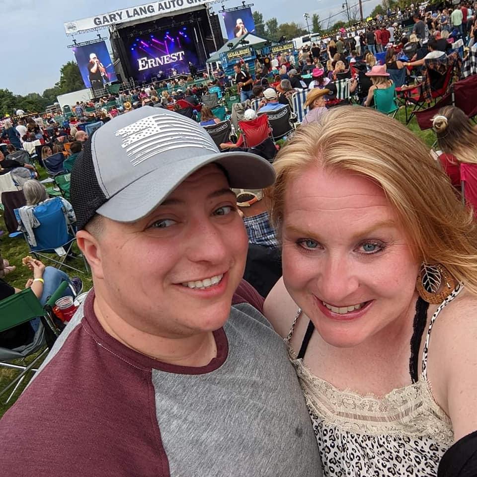 Waiting for Kenny Chesney...we didn't know that by the end of the night we would be SOAKED in a rain storm!