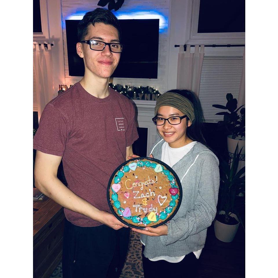 Zach's sister, Grace, got a cookie cake for us and wrote this message on the cake. This was the day after we got engaged!