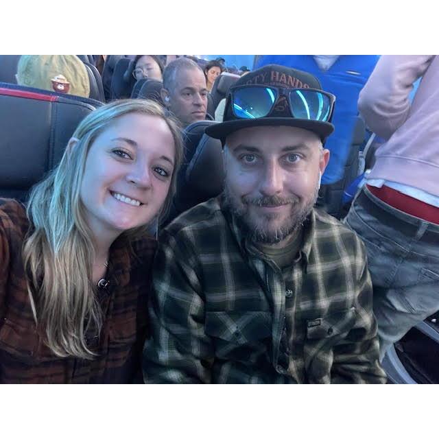 Overly tired couple on a plane... we have had many this past year