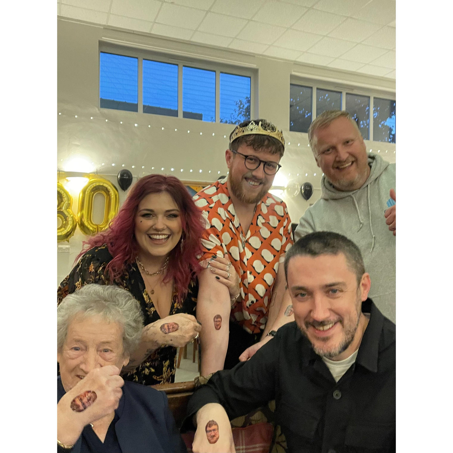 Madeline ordered 40 tattoos of Kieran's face, and they were a hit with everyone, including the owner, and the drag queen we gave one to later in the night