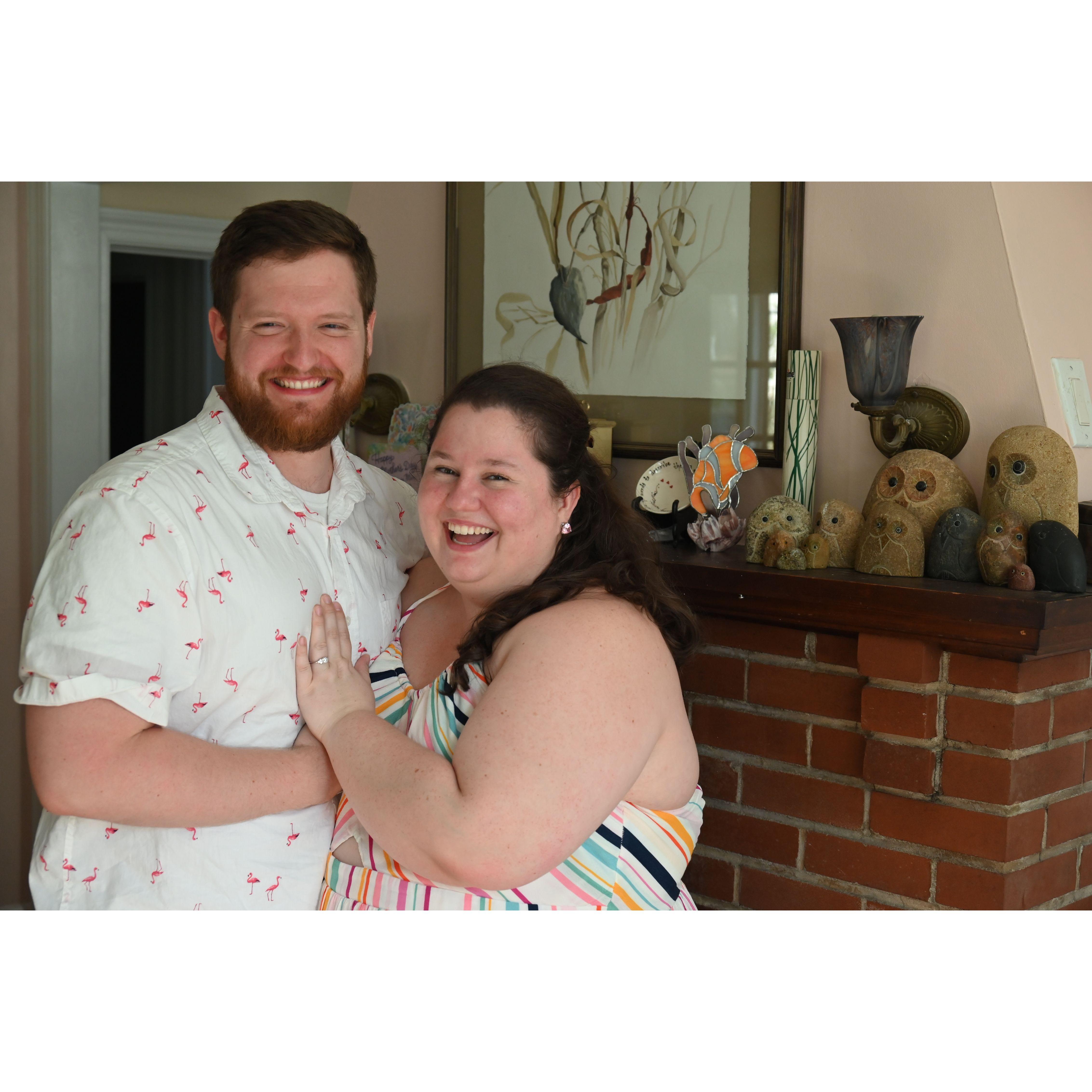 Jamiee and Alex with the owl family right after Alex proposed.