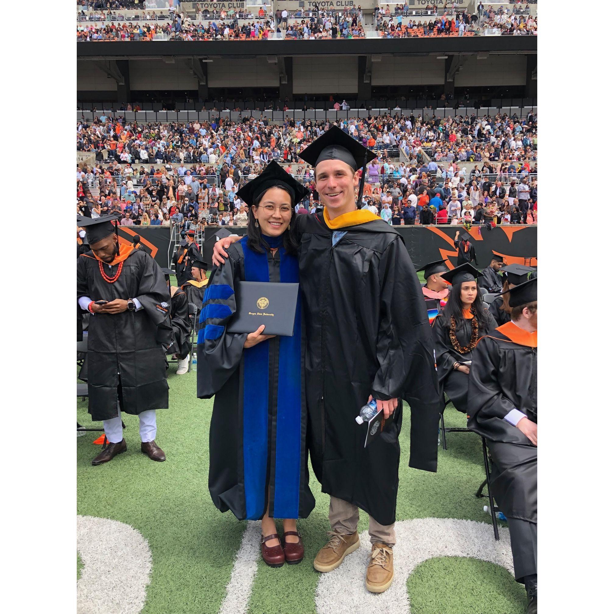 In June 2023, Megan and John graduated from grad school together. Look at those fancy hats!