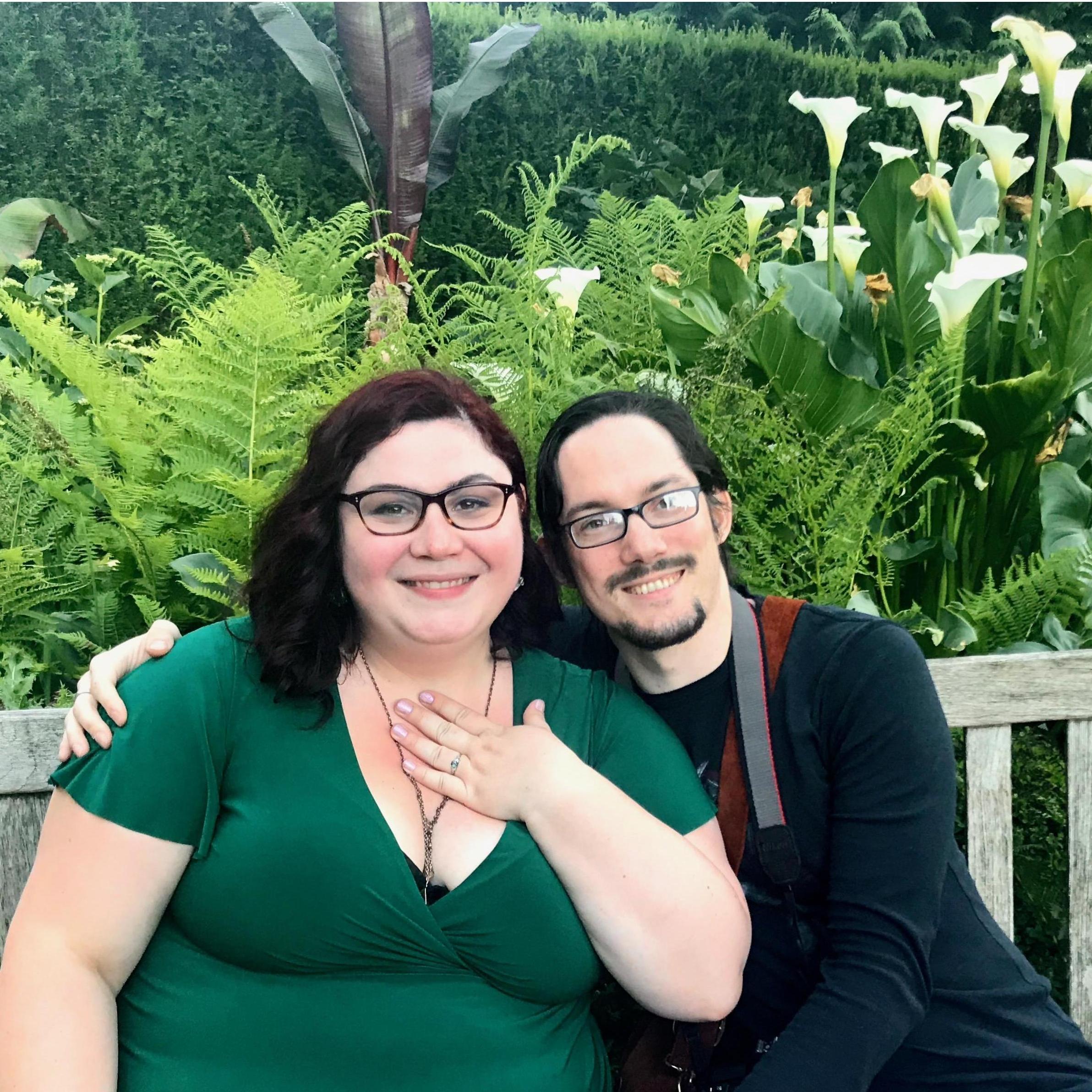 A random dude took this photo of us at the International Rose Test Garden after he realized he walked right into Robert's proposal.