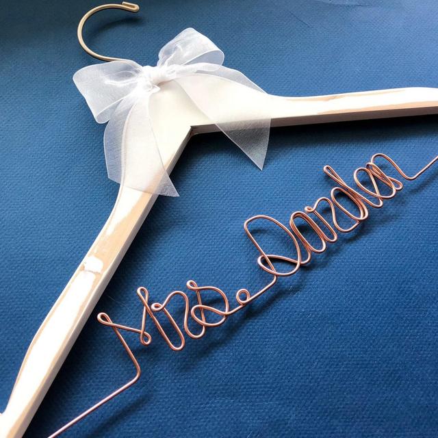 White hanger with gold wire & bow