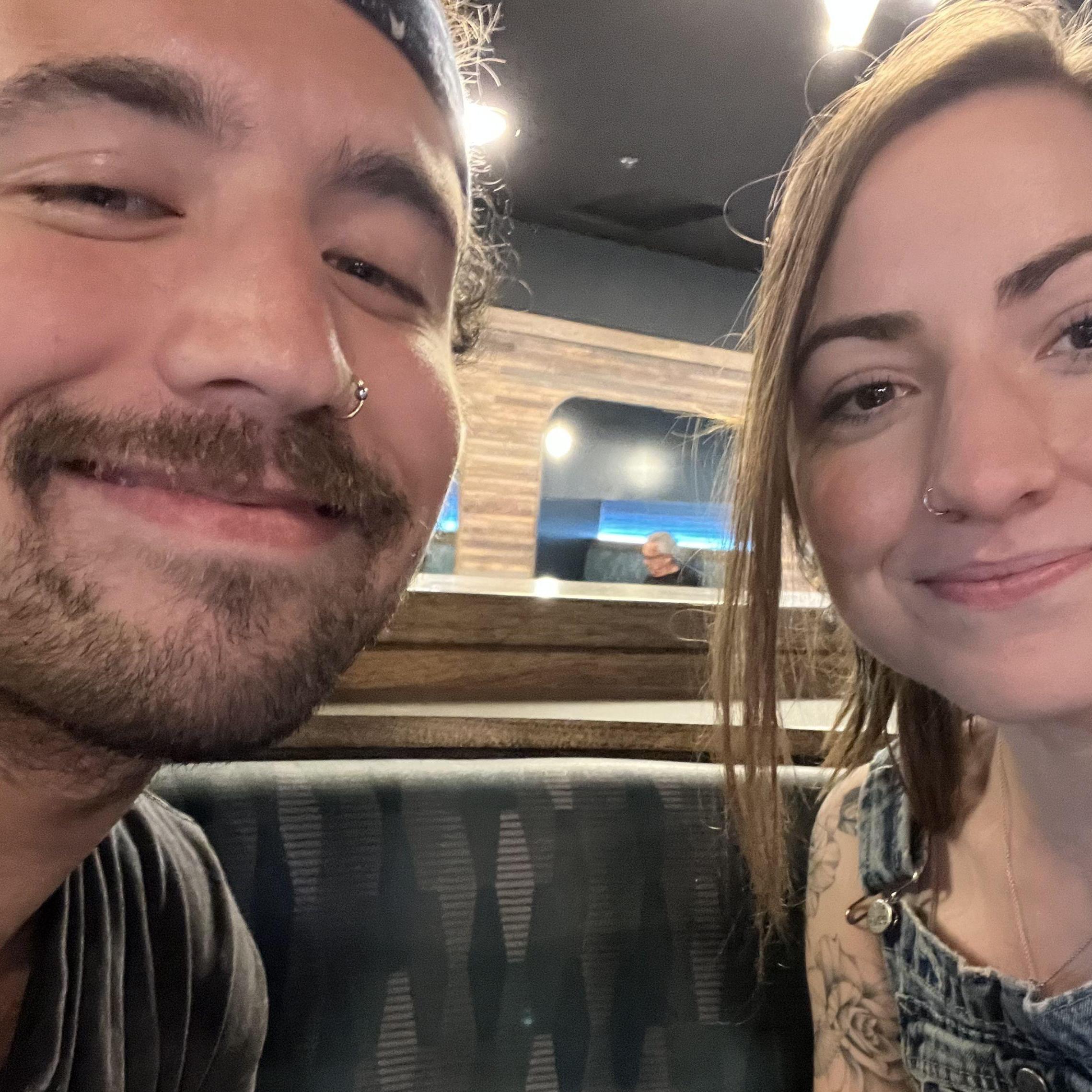 Us on our first date after becoming official. We ran into Bill Johnson who was also on a date. IYKYK