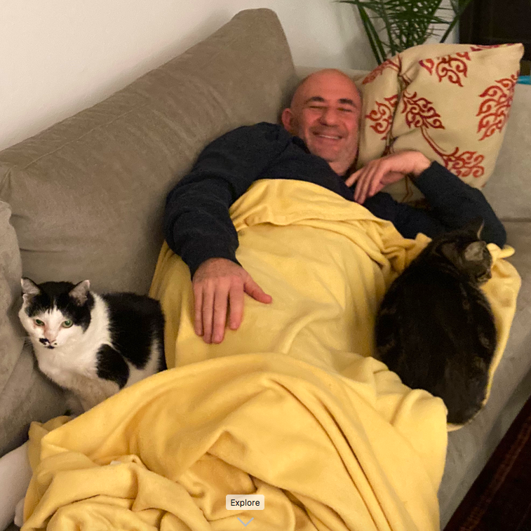 That smile is the realization that life is so much better with cats!