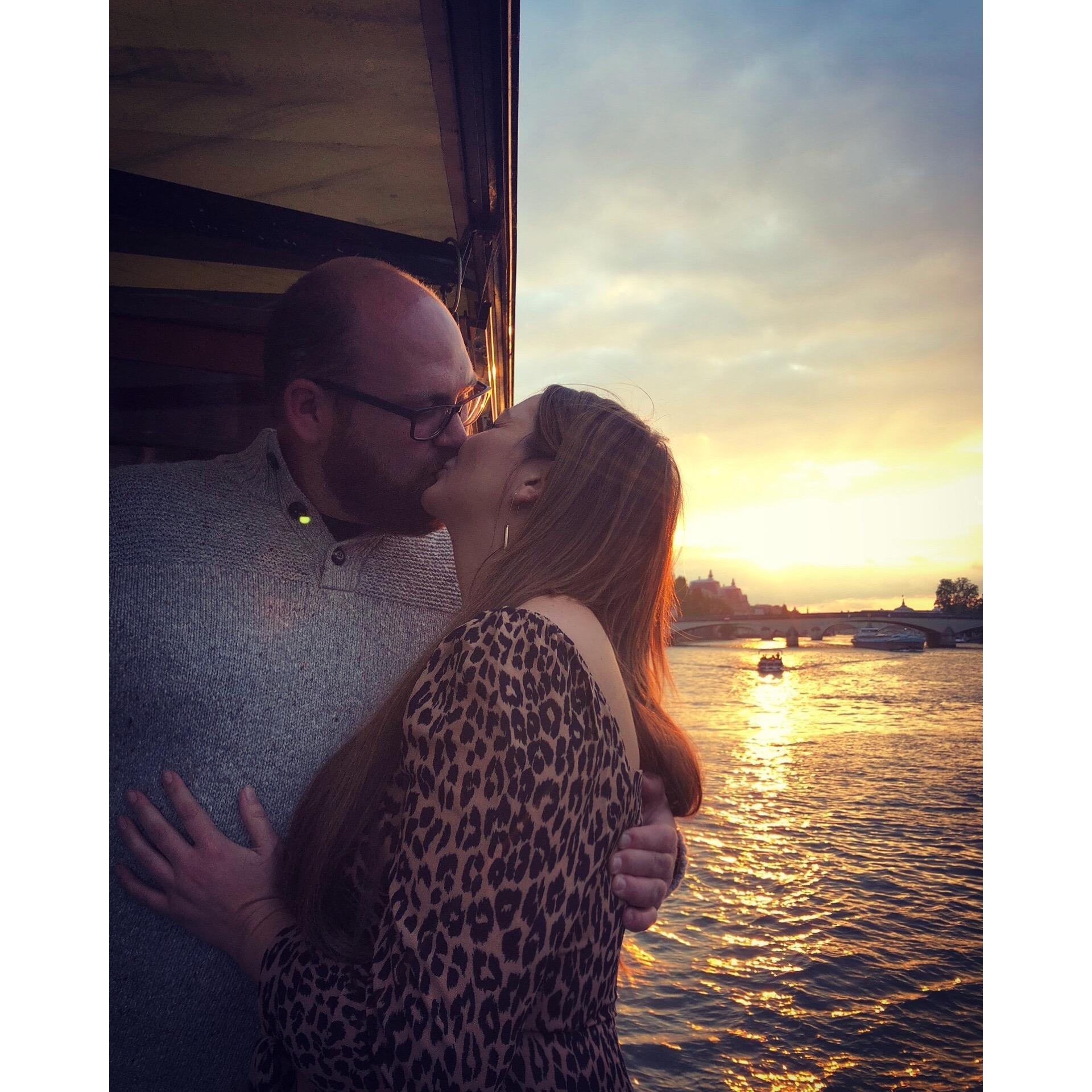In love, in Paris. Cruising down The Seine at sunset.