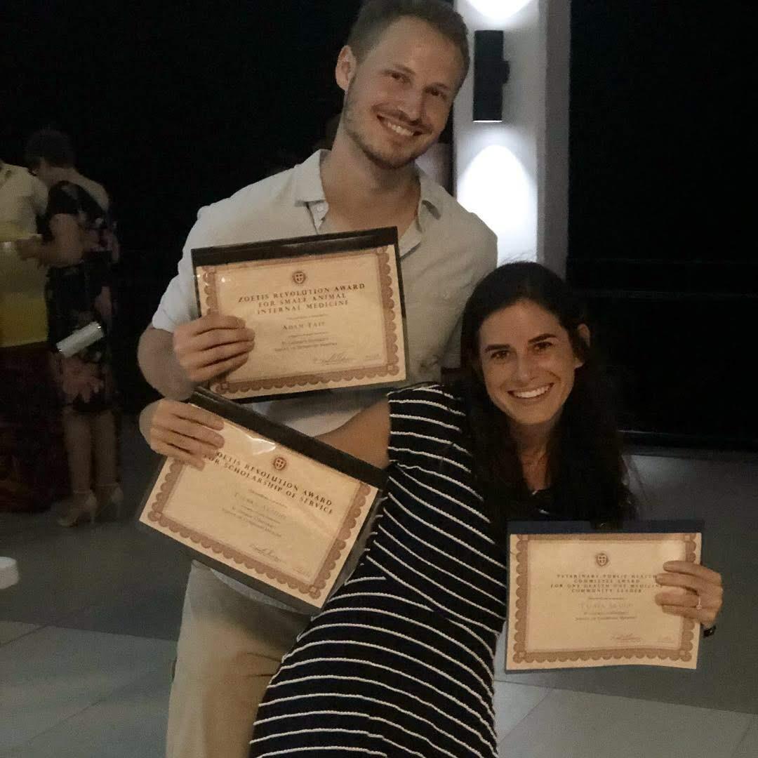 Us holding Adam's 3 awards. Don't zoom in