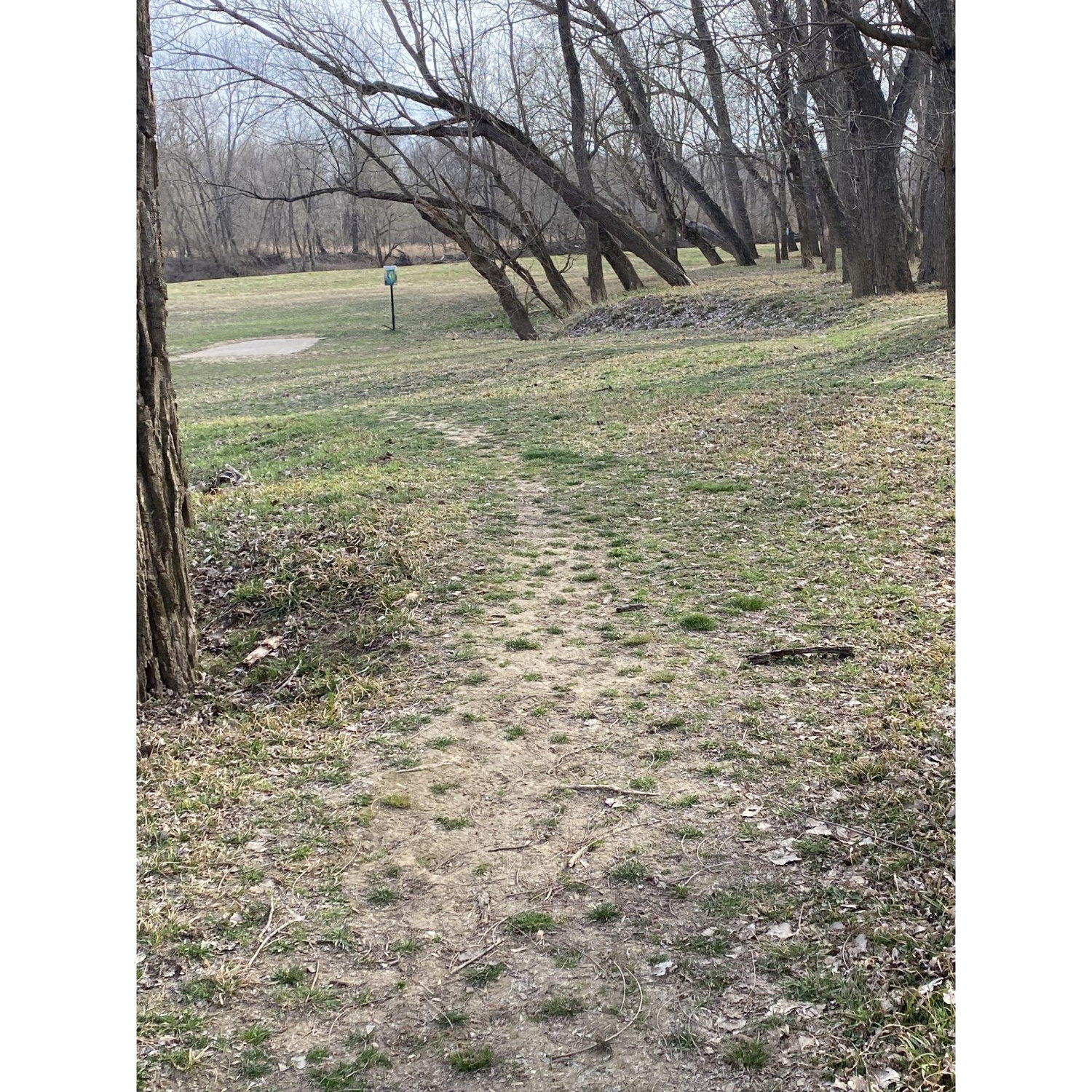 Here's the other side.. head towards the concrete pad with the hole 13 sign next to it.