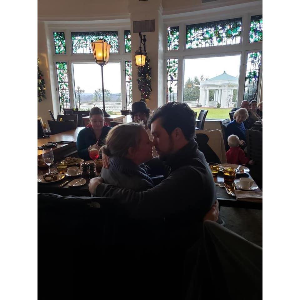 Sharing a kiss after the surprise proposal.