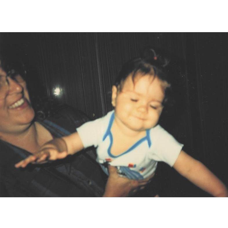 Alexis taking flight with the help of her grandma, Zondra (1996)
