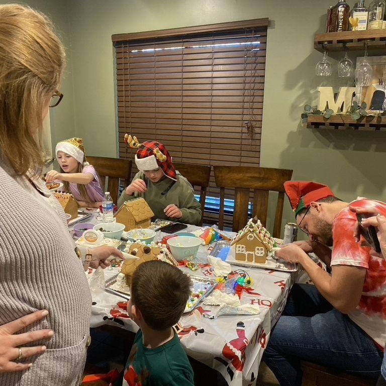 December 2024 | Michael very intently (and intensely) decorating a gingerbread house with Katie's nieces and nephews
